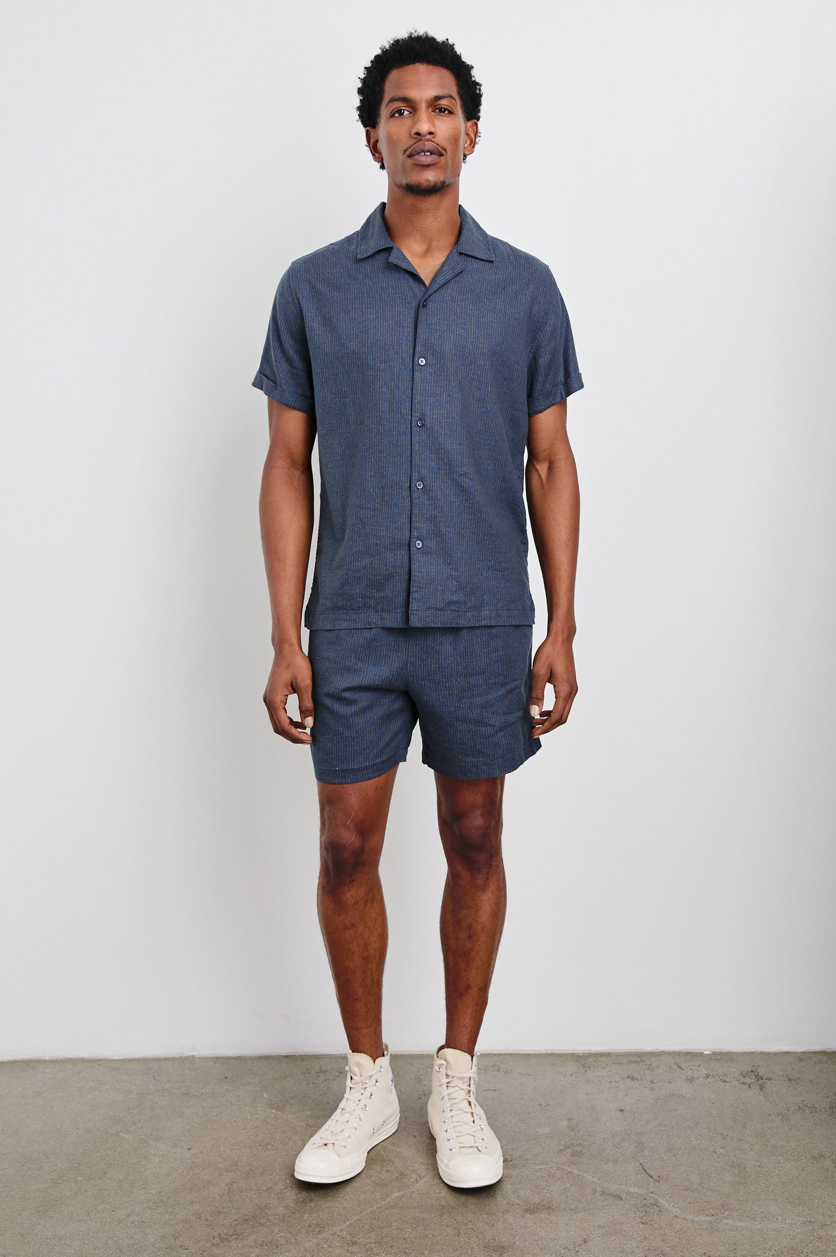 Atlas Short-Sleeve Button Up in Navy Cedar Vertical Colorway, with Thin Vertical Cedar Dashes on Navy - Front Full Body View Featured on Model