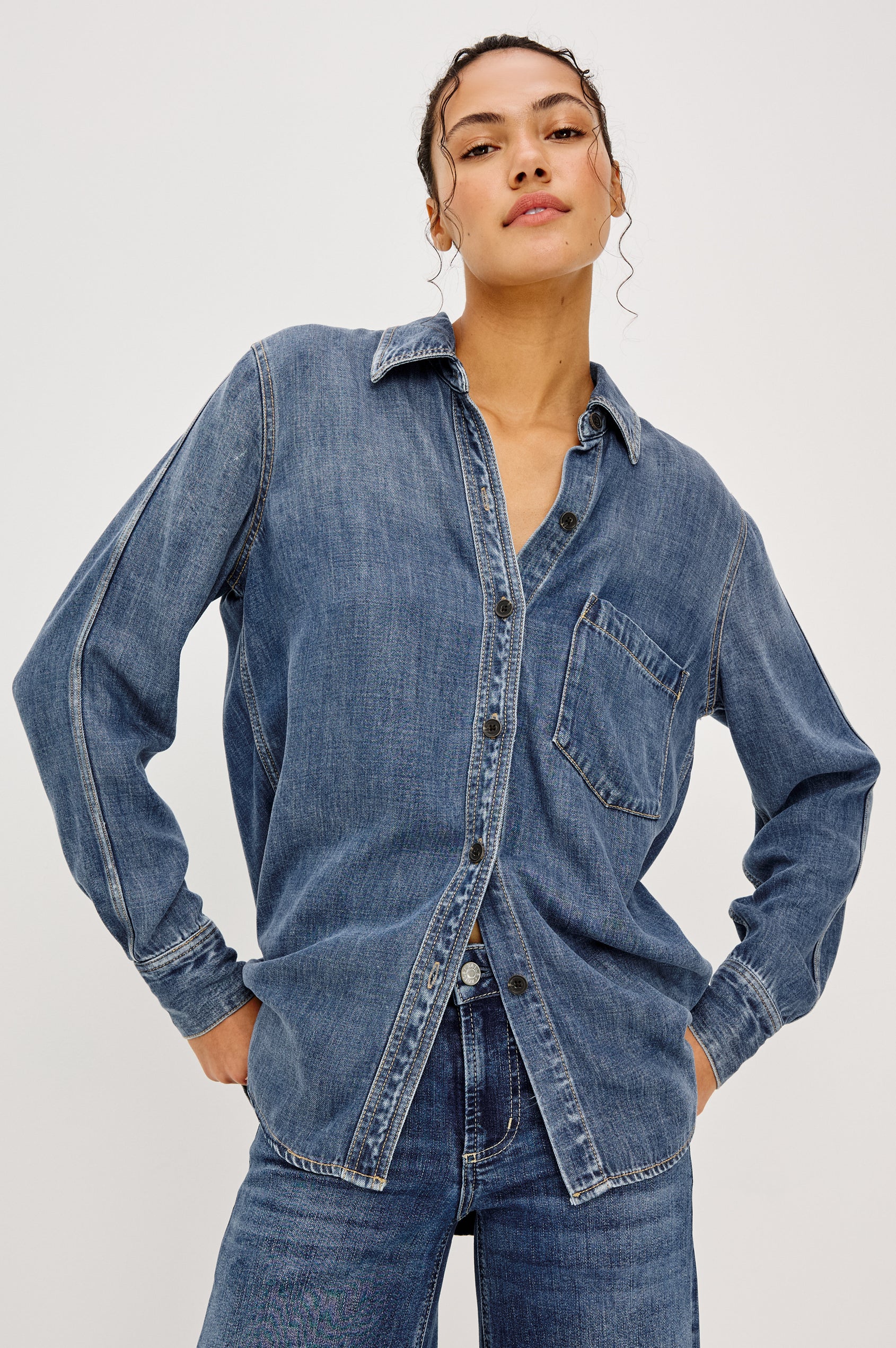 Atticus Shirt in Cotton Lyocell Denim With Collar, Long Sleeves, and Chest Patch Pocket in Antique Blue Colorway - Upper Body Front View Featured on Model