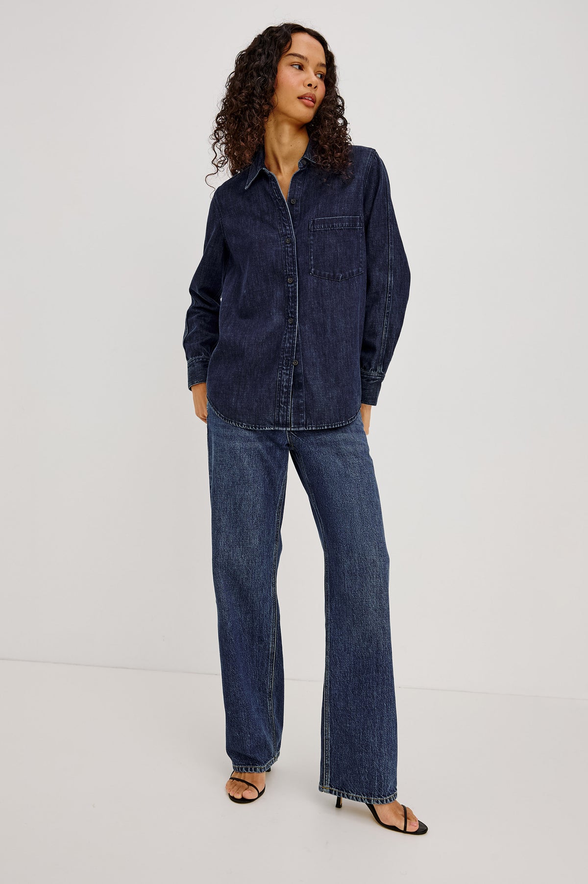 Atticus Shirt in TENCELâ„¢ Denim With Relaxed Fit, Point Collar, Front Button, and Long Sleeves With Flat-Felled Seams and Buttoned Cuffs in Blue Ridge Colorway - Full Body Front View Featured on Model