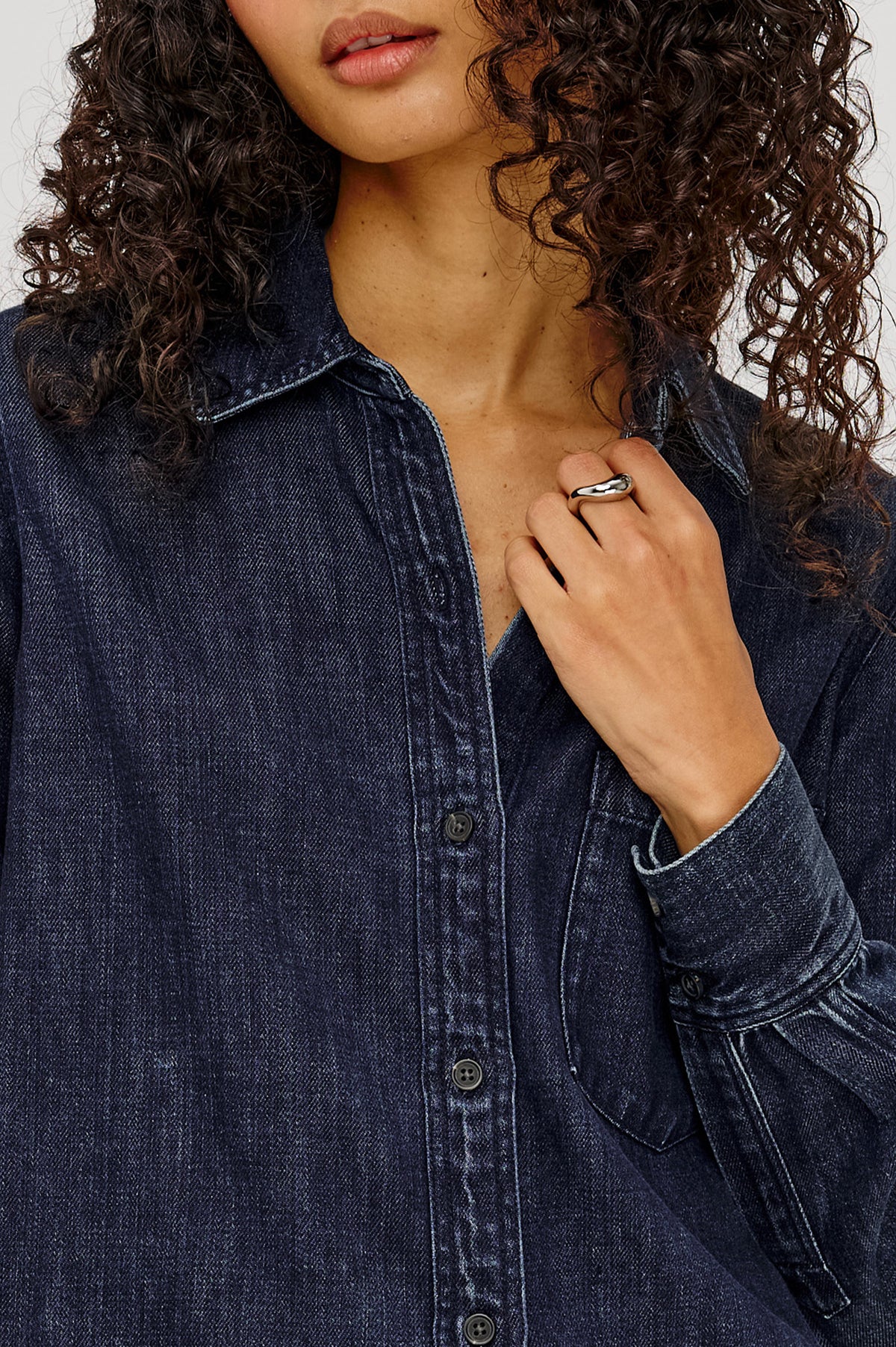 Atticus Shirt in TENCELâ„¢ Denim With Relaxed Fit, Point Collar, Front Button, and Long Sleeves With Flat-Felled Seams and Buttoned Cuffs in Blue Ridge Colorway - Upper Body Close Up View Featured on Model