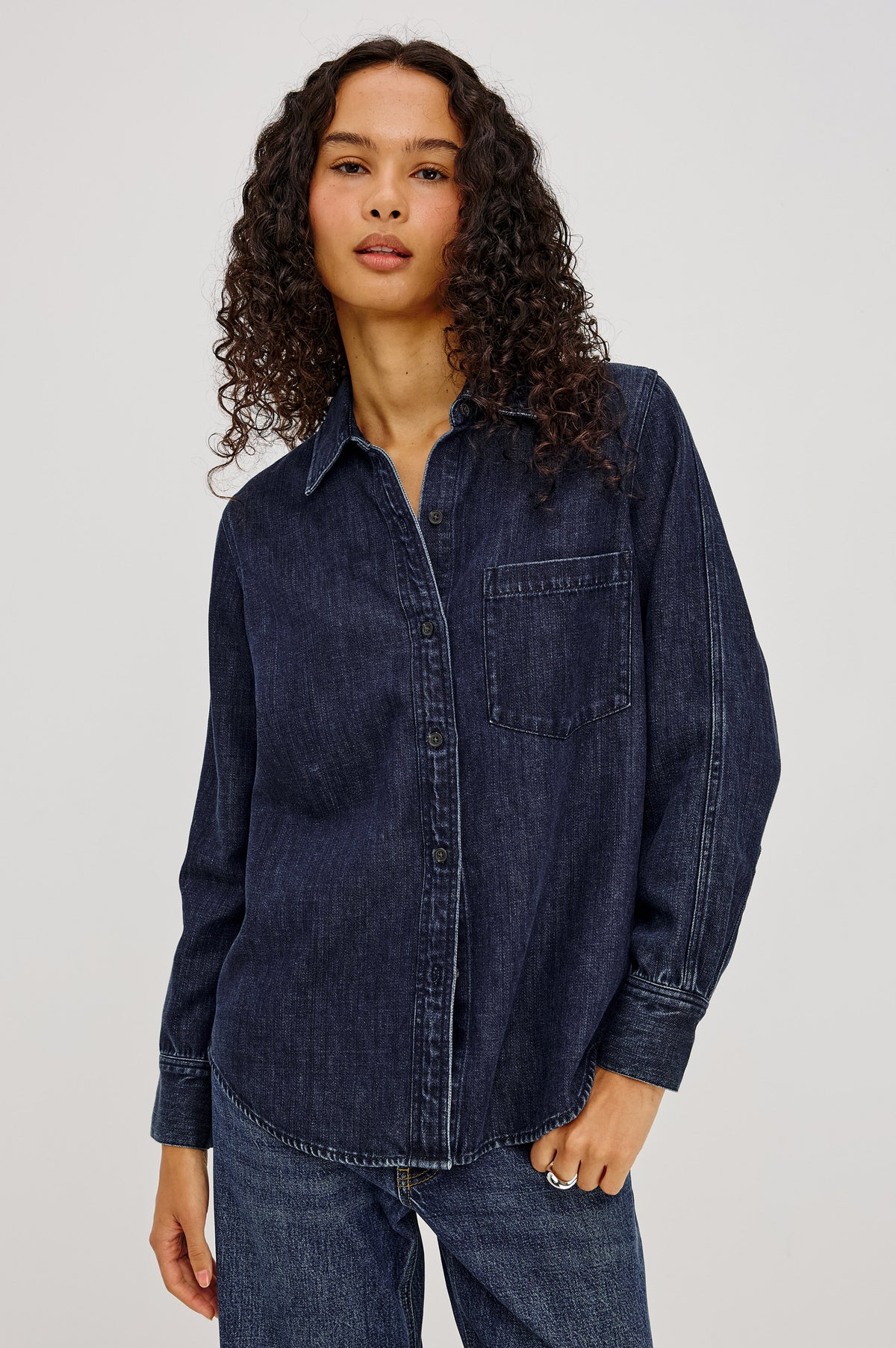 Atticus Shirt in TENCELâ„¢ Denim With Relaxed Fit, Point Collar, Front Button, and Long Sleeves With Flat-Felled Seams and Buttoned Cuffs in Blue Ridge Colorway - Upper Body Front View Featured on Model