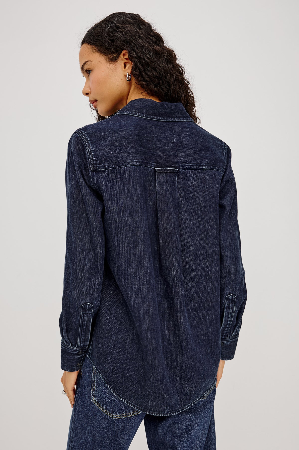 Atticus Shirt in TENCELâ„¢ Denim With Relaxed Fit, Point Collar, Front Button, and Long Sleeves With Flat-Felled Seams and Buttoned Cuffs in Blue Ridge Colorway - Upper Body Back View Featured on Model