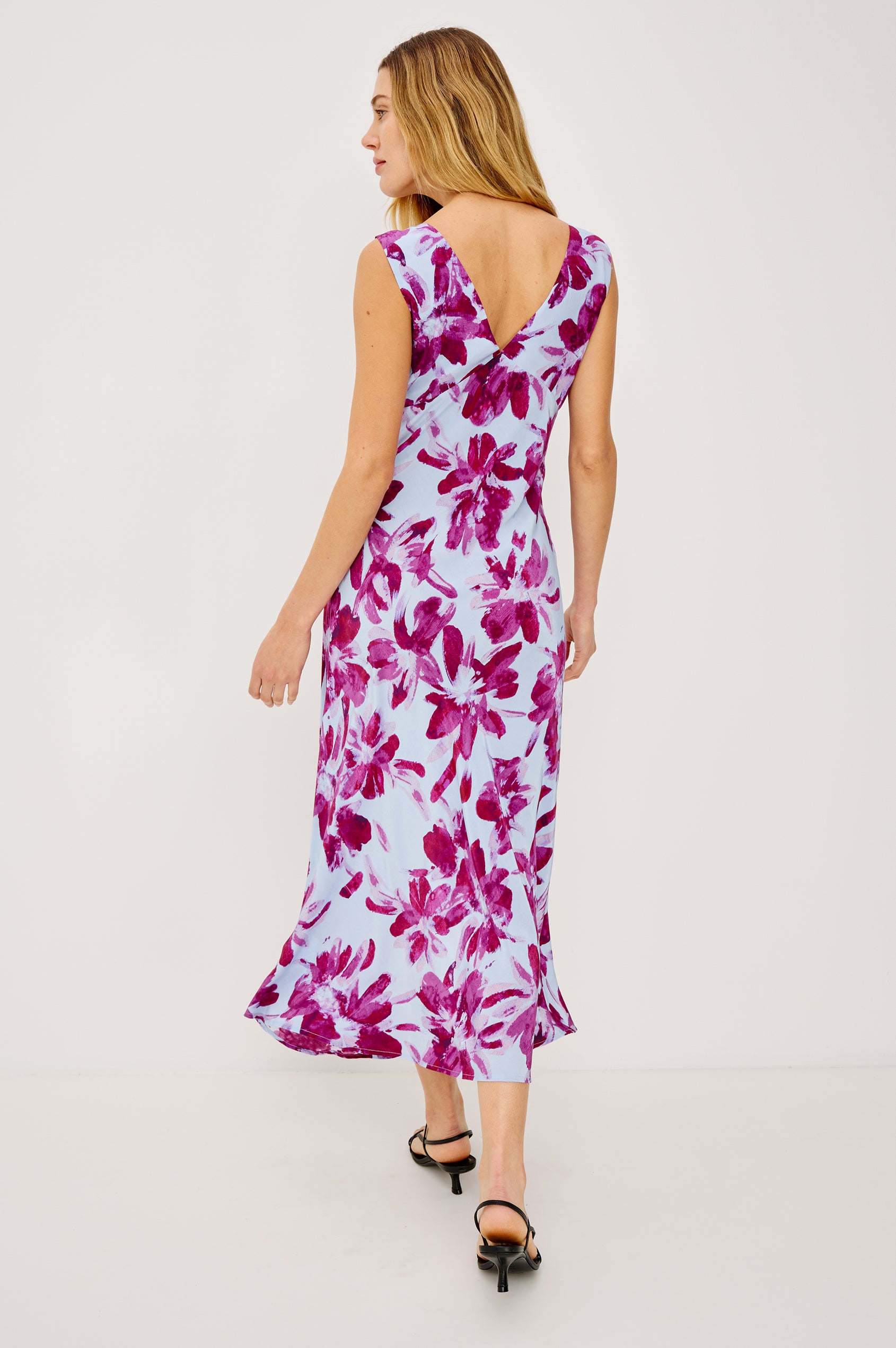 Audrina Sleeveless Midi Dress with Wide Shoulder Straps, a Deep V Neck and V-Back, and an Empire Waist in Blue Lily Colorway - back view on model