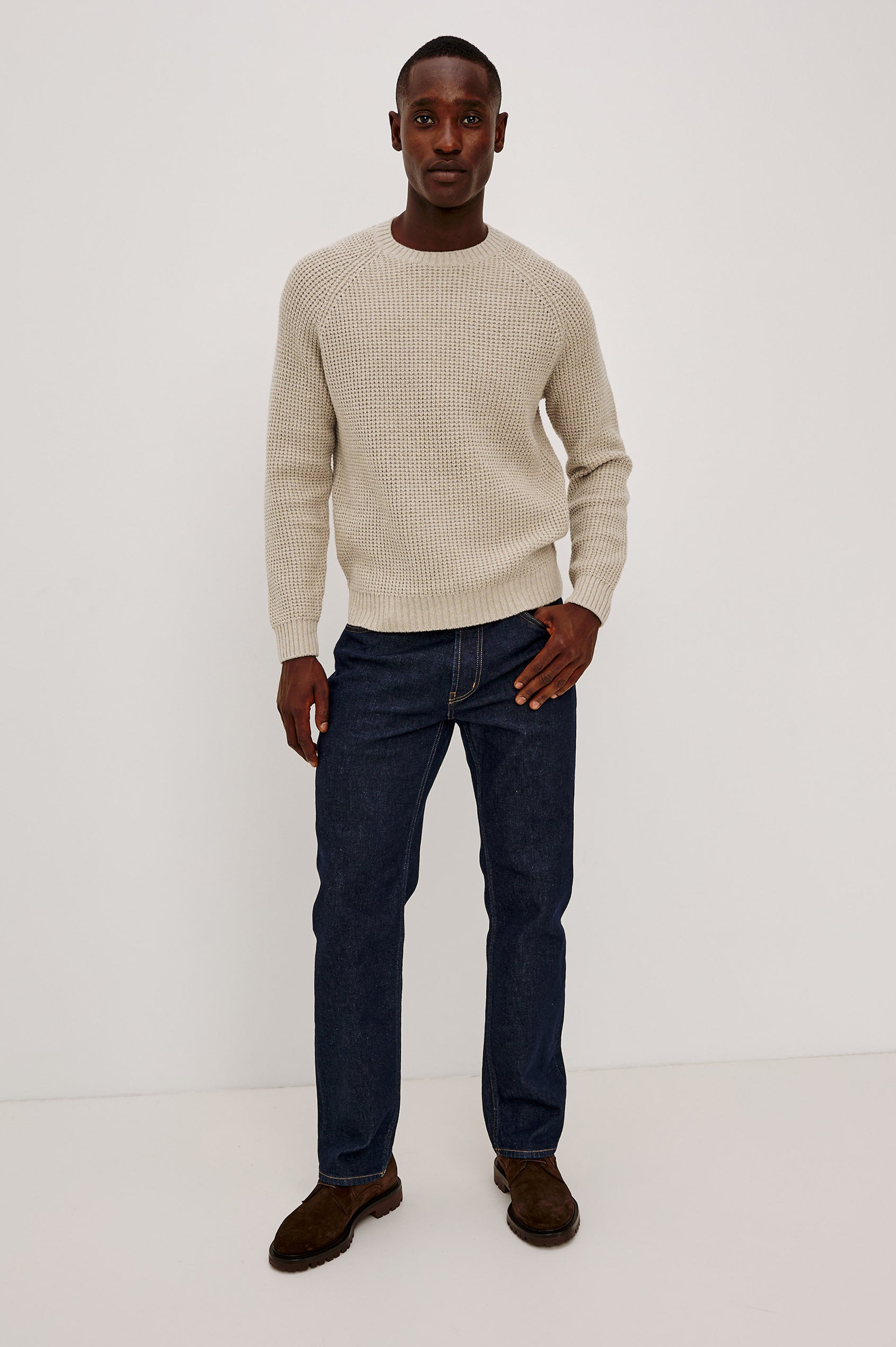 Augustus Sweater in Midweight Cotton-Linen Knit With Thermal Stitch, Textured Bouclé Finish, Raglan Long Sleeves, and Ribbed Trim in Vellum Colorway - Full Body Front View Featured on Model