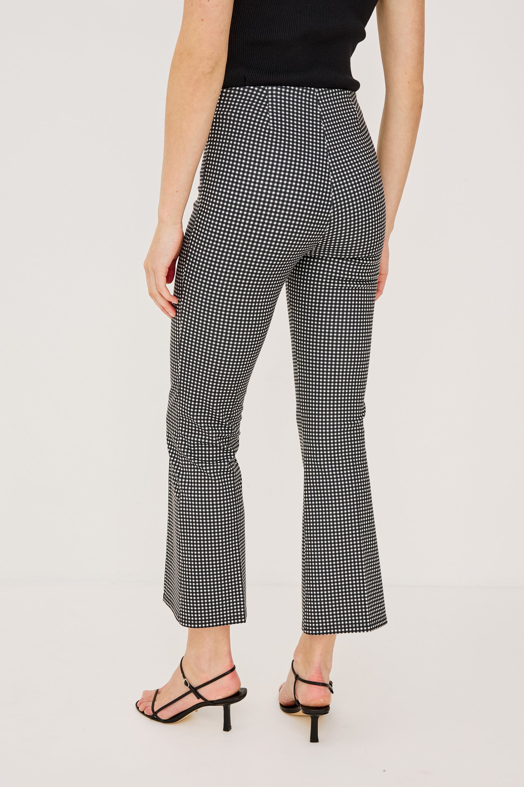 Auray Pant in Ponte With High-Waisted Fit Front Pintuck Detailing Cropped Length Elastic Waistband and Kick Flare at Hem in Black Gingham Colorway - Lower Body Back View Featured on Model