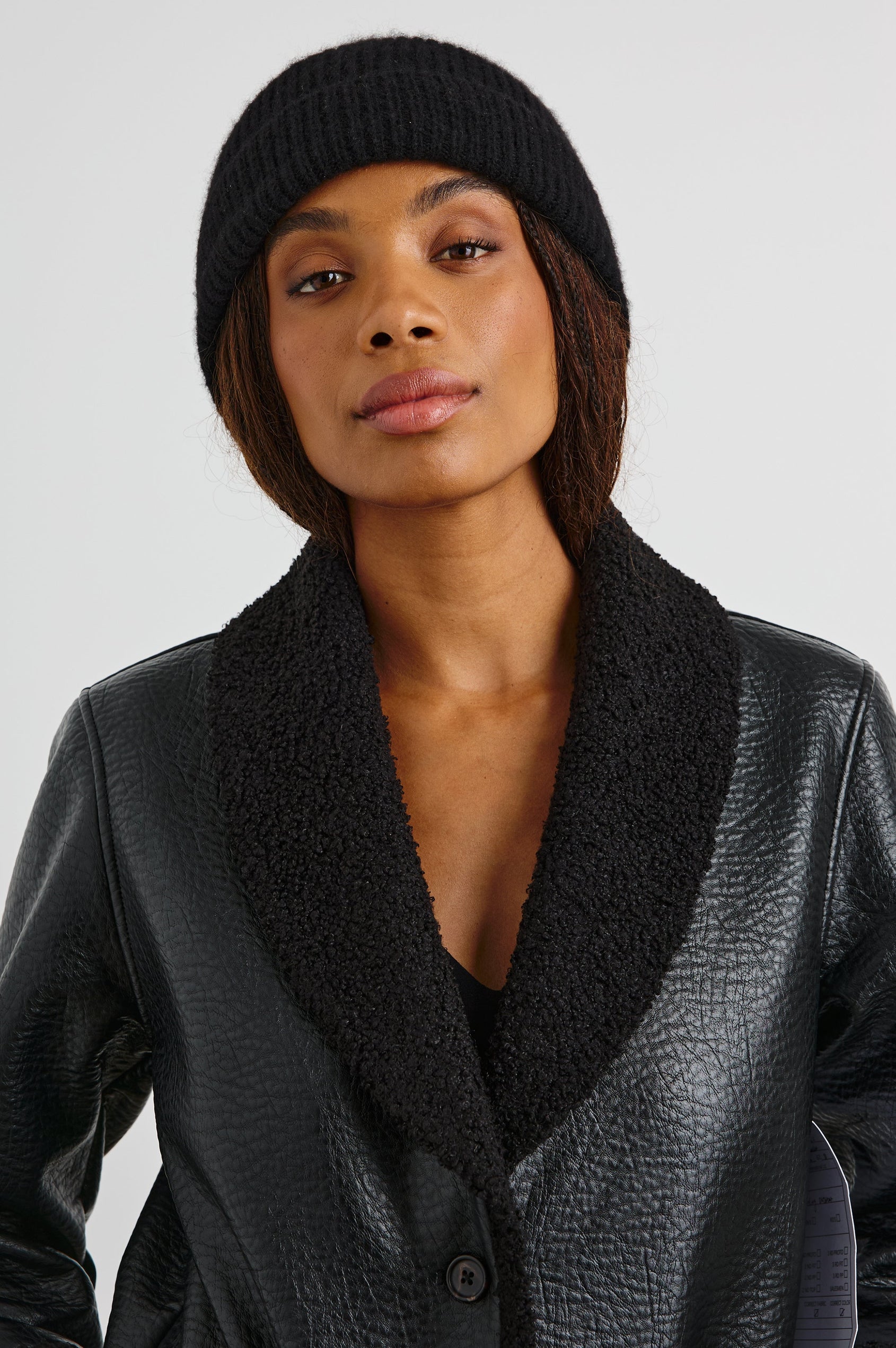 Autumn Cashmere Silk Cuffed Beanie in Black Colorway - Front View Featured on Model