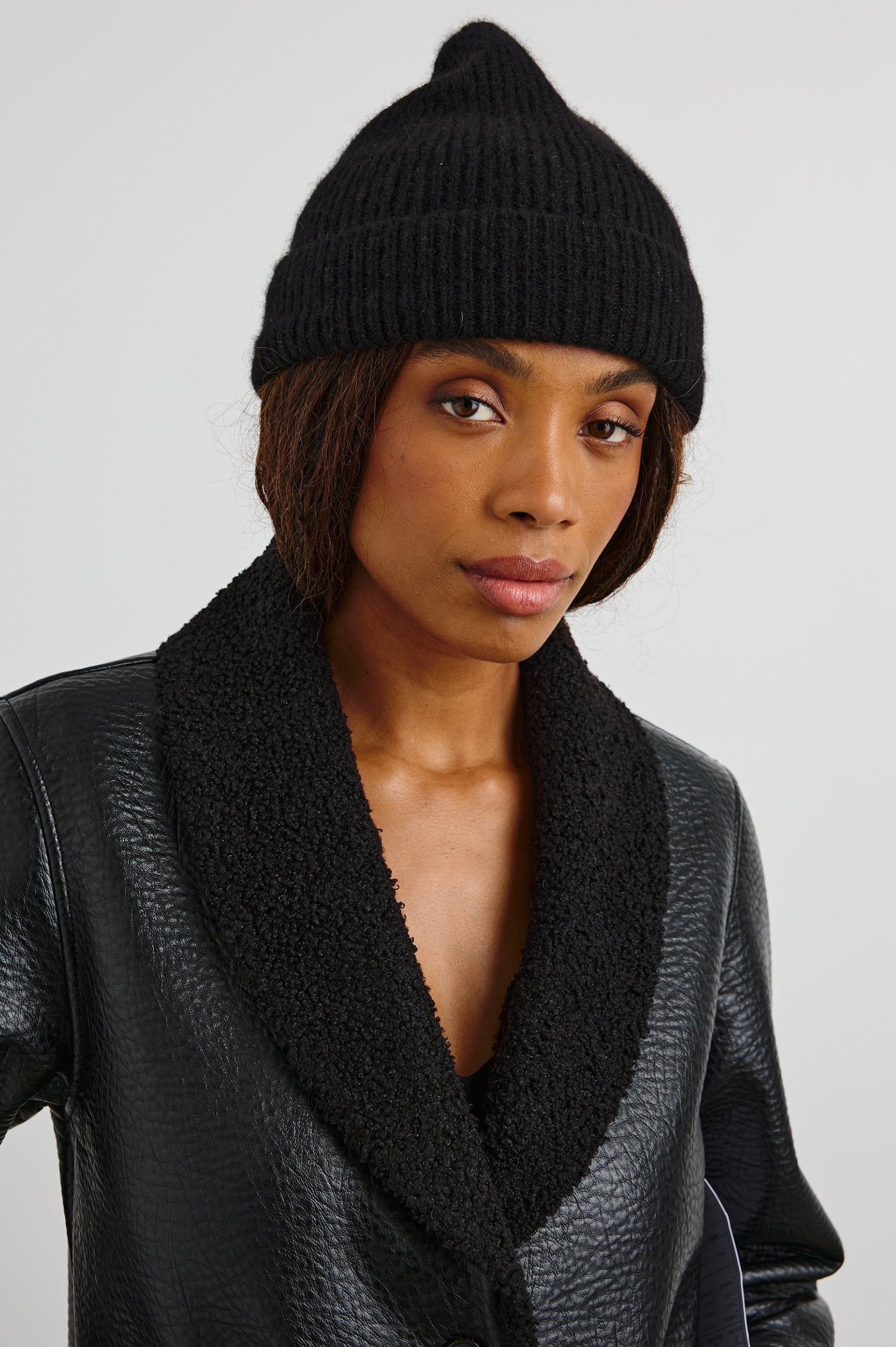 Autumn Cashmere Silk Cuffed Beanie in Black Colorway - Front View Featured on Model