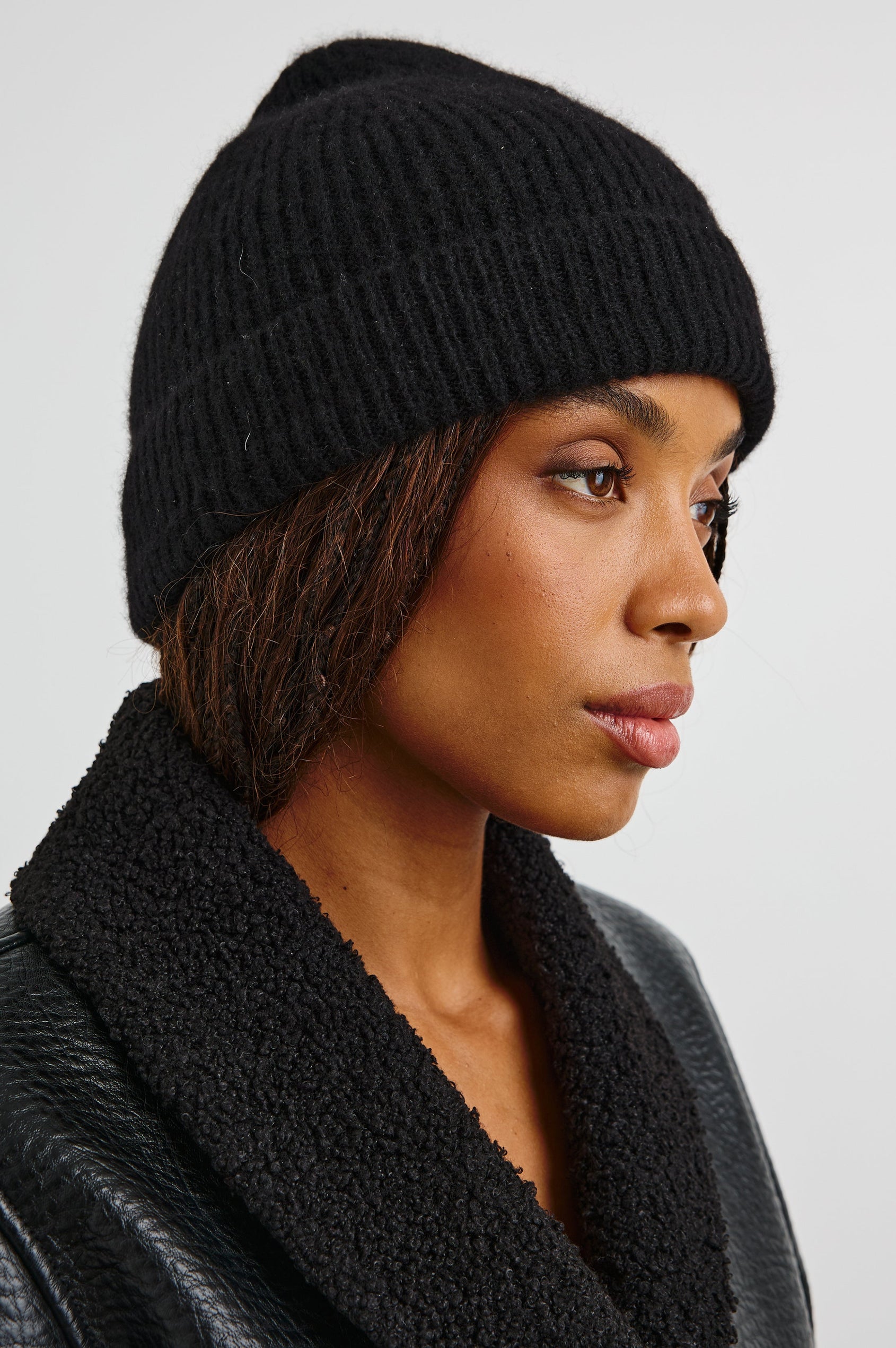 Autumn Cashmere Silk Cuffed Beanie in Black Colorway - Front View Featured on Model