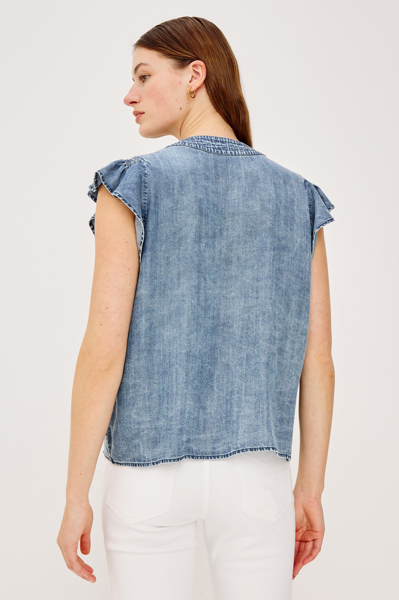 Aviva Top in TENCELâ„¢ Denim With Smocked Flutter Sleeves Split V-Neck With Embroidered Collar and Self-Ties and Front Buttons in Blue Ridge Colorway - Upper Body Back View Featured on Model