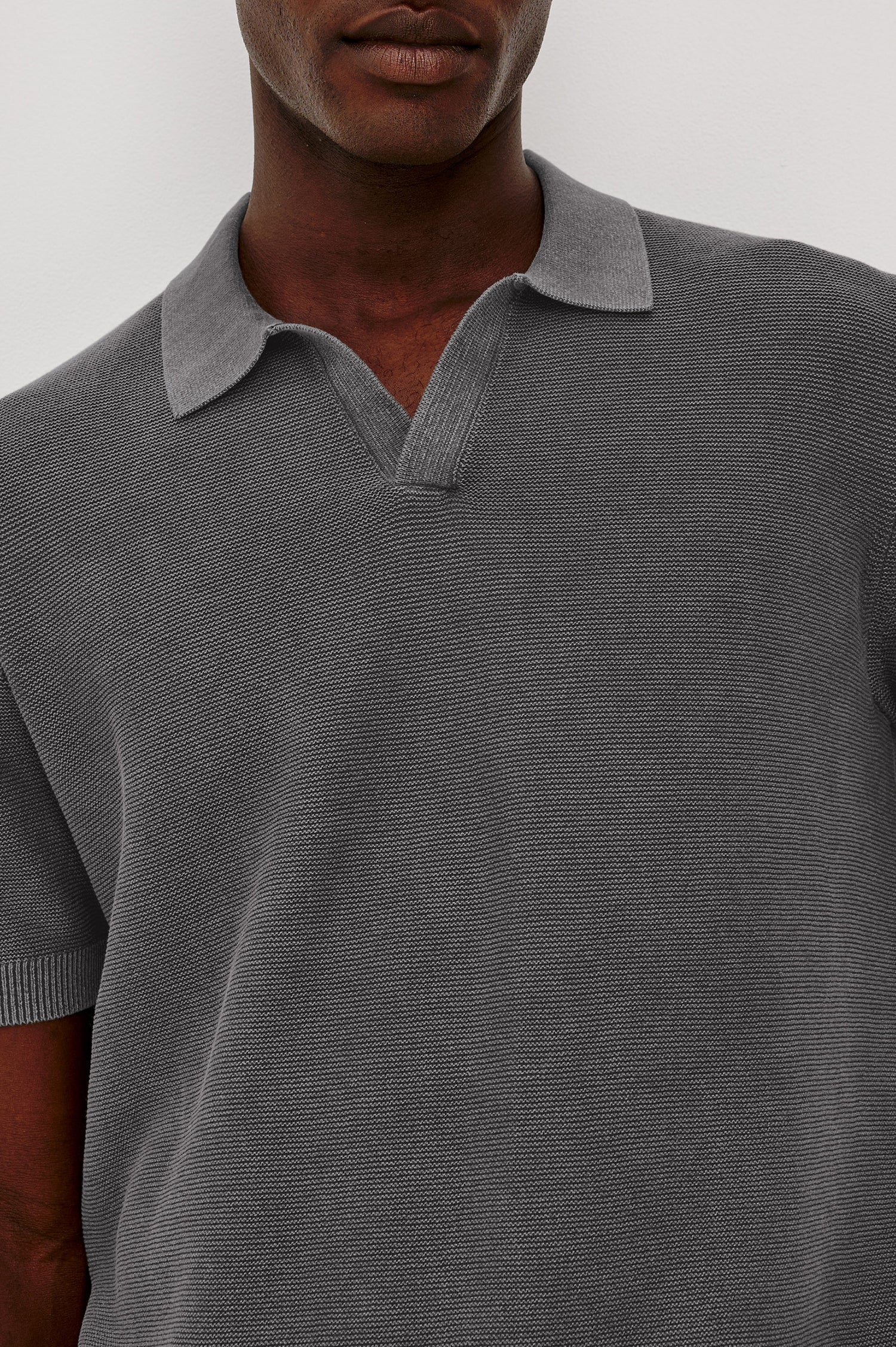 Baker Polo Shirt in Cotton Knit With Sun-Washed Effect, Open-Placket Collar, Short Sleeves, and Relaxed Fit in Sunfaded Black Colorway - Upper Body Front View Featured on Model