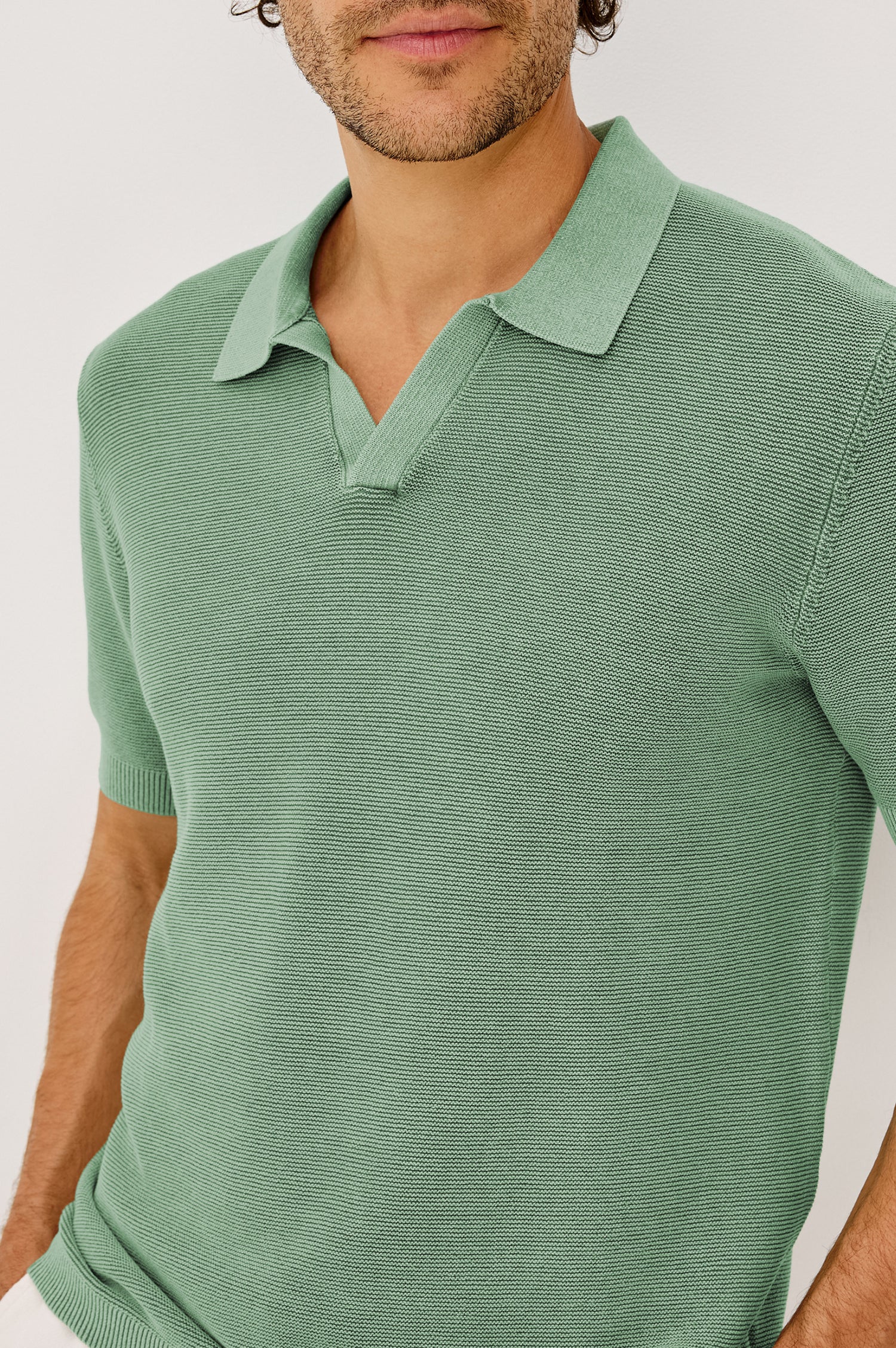 Baker Polo Shirt in Rib Cotton Knit With Colar, Short Sleeves, and Relaxed Fit in Vetiver Colorway - Upper Body Front View Featured on Model