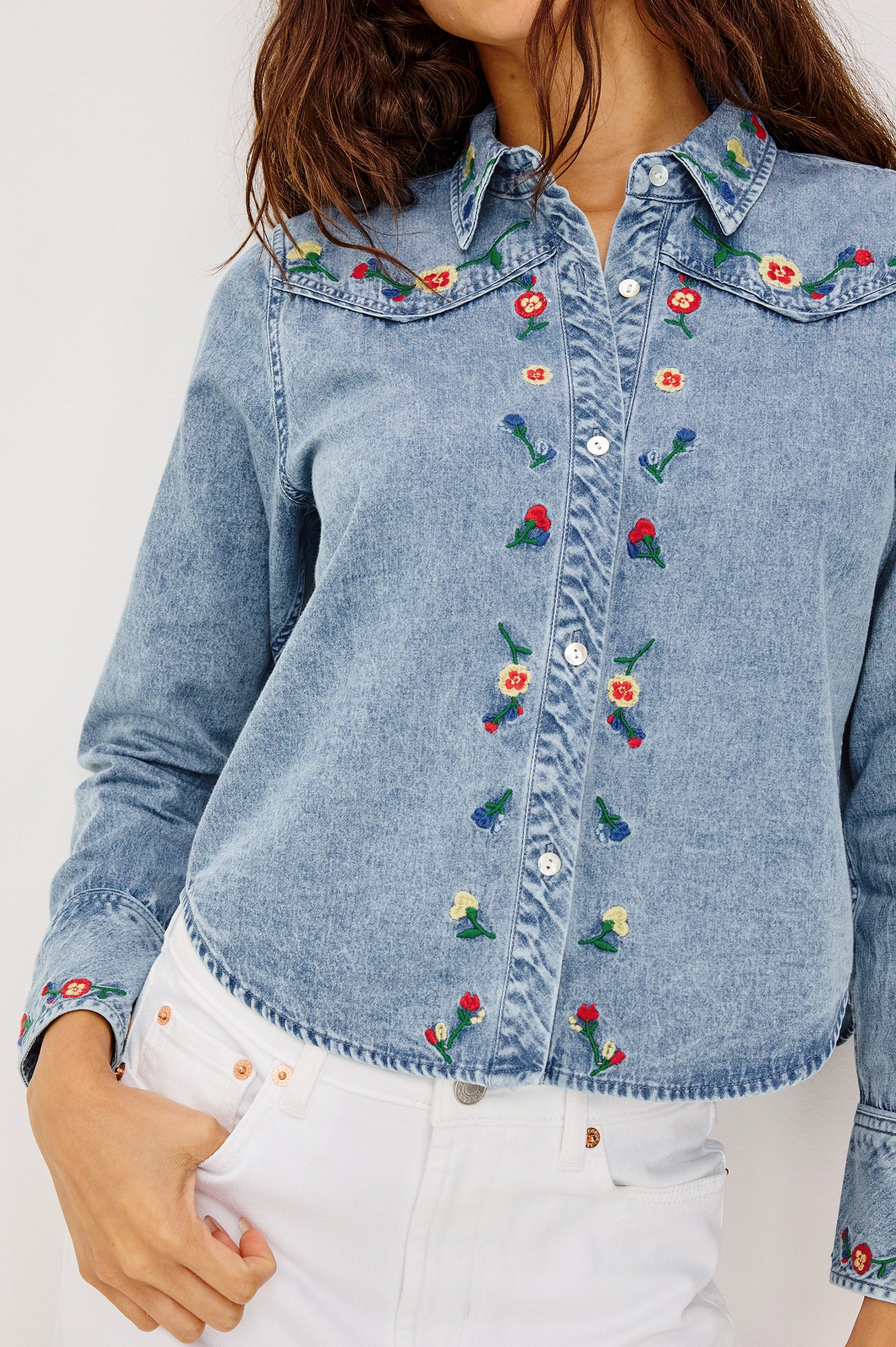 Bari Shirt in Cotton Chambray With Collar, Front Buttons, and Long Sleeves in Indigo Floral Embroidery Colorway - Upper Body Front VIew Featured on Model