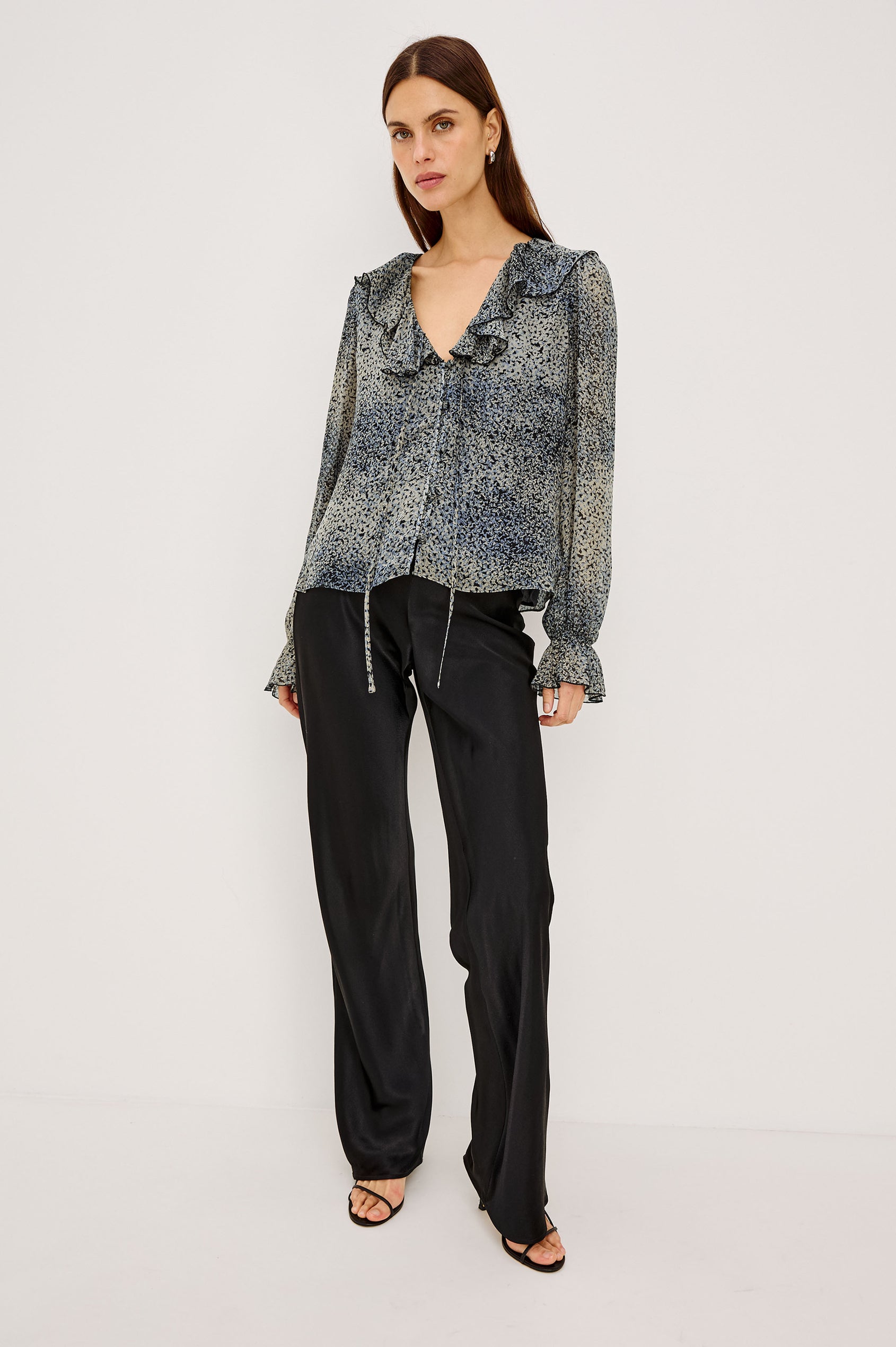 Becky Shirt in Self-Lined Chiffon With Deep V-Neckline, Ruffle Collar, Center Front Self-Tie, Long Sleeves, and Elastic Ruffle Cuffs in Agate Colorway - Full Body Front View Featured on Model