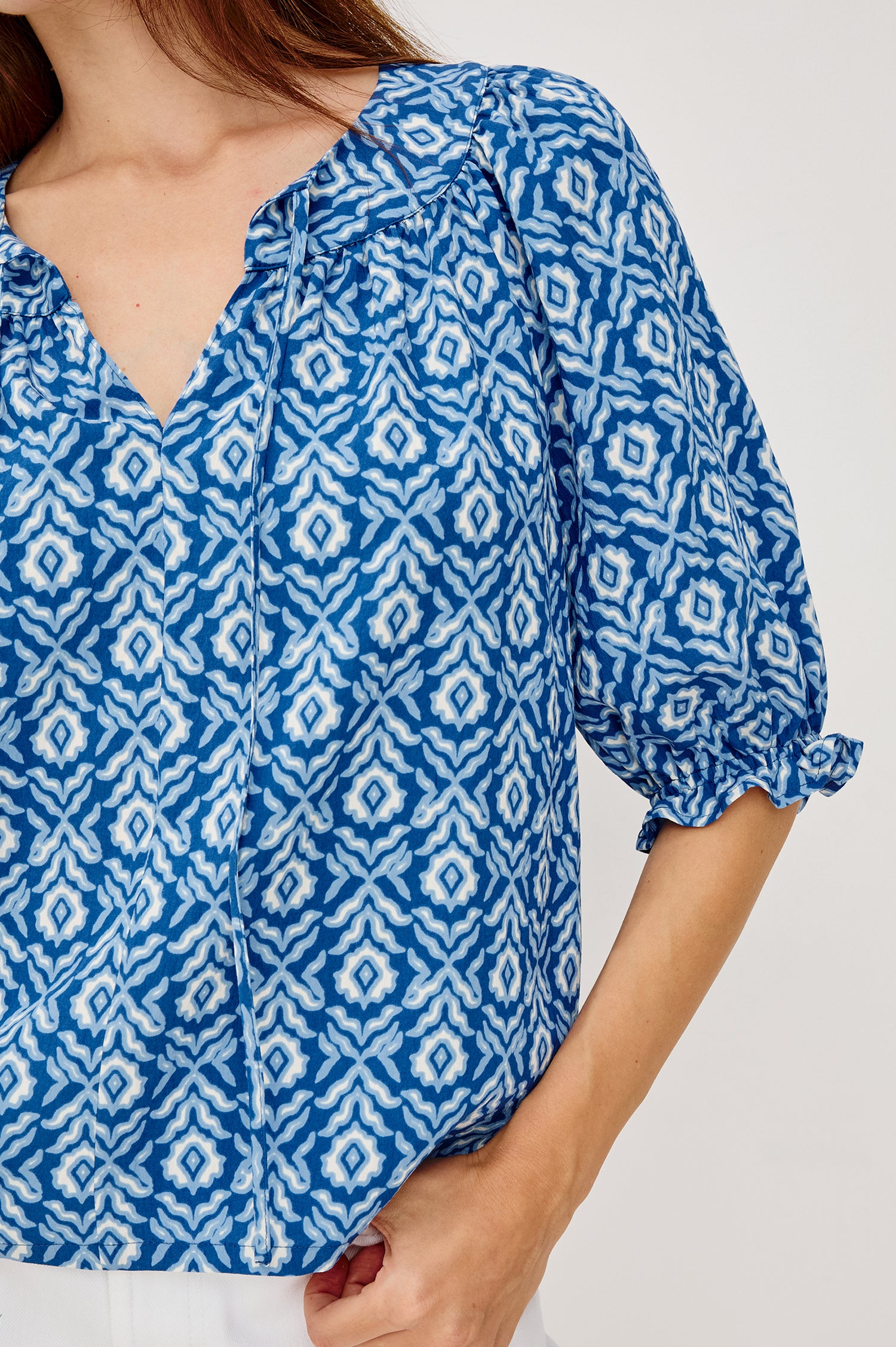 Belina Top With Gathrered V-Neck With Self-Ties Elbow Length Sleeves in Blue Ikat Colorway - Upper Body Front Close Up View Featured on Model