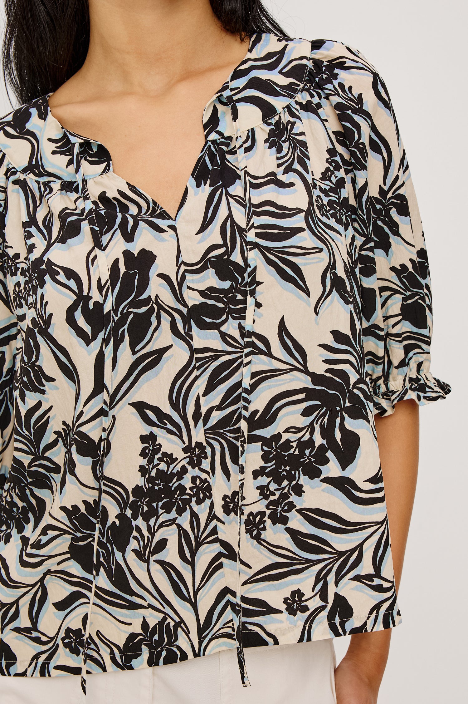 Belina Peasant Top in Crinkle Poplin With Gathered V-Neckline With Self Ties, Blanket Stitch Embroidered Trim, Loose Fit, and Elbow-Length Puff Sleeves With Elastic Cuffs in Zinya Colorway - Upper Body Front View Featured on Model