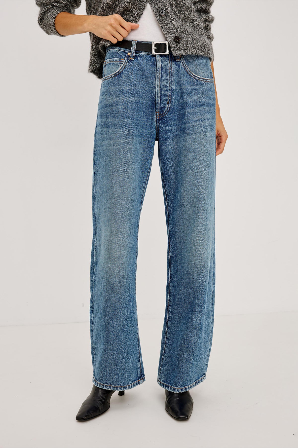 Petite Belmont Arc Leg Jean in Rigid Denim With High Rise, Distressed Detailing, Button Fly, and 5-Pockets in Homestead Colorway - Front View Featured on Model