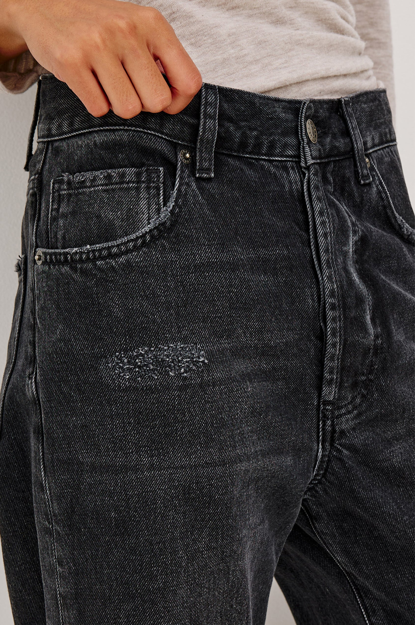 Belmont Petite Arc Leg Jean in Rigid Denim With High Rise, Distressed Detailing, Button Fly, and 5-Pockets in Nightcap Colorway - Mid Body Front Close Up View Featured on Model