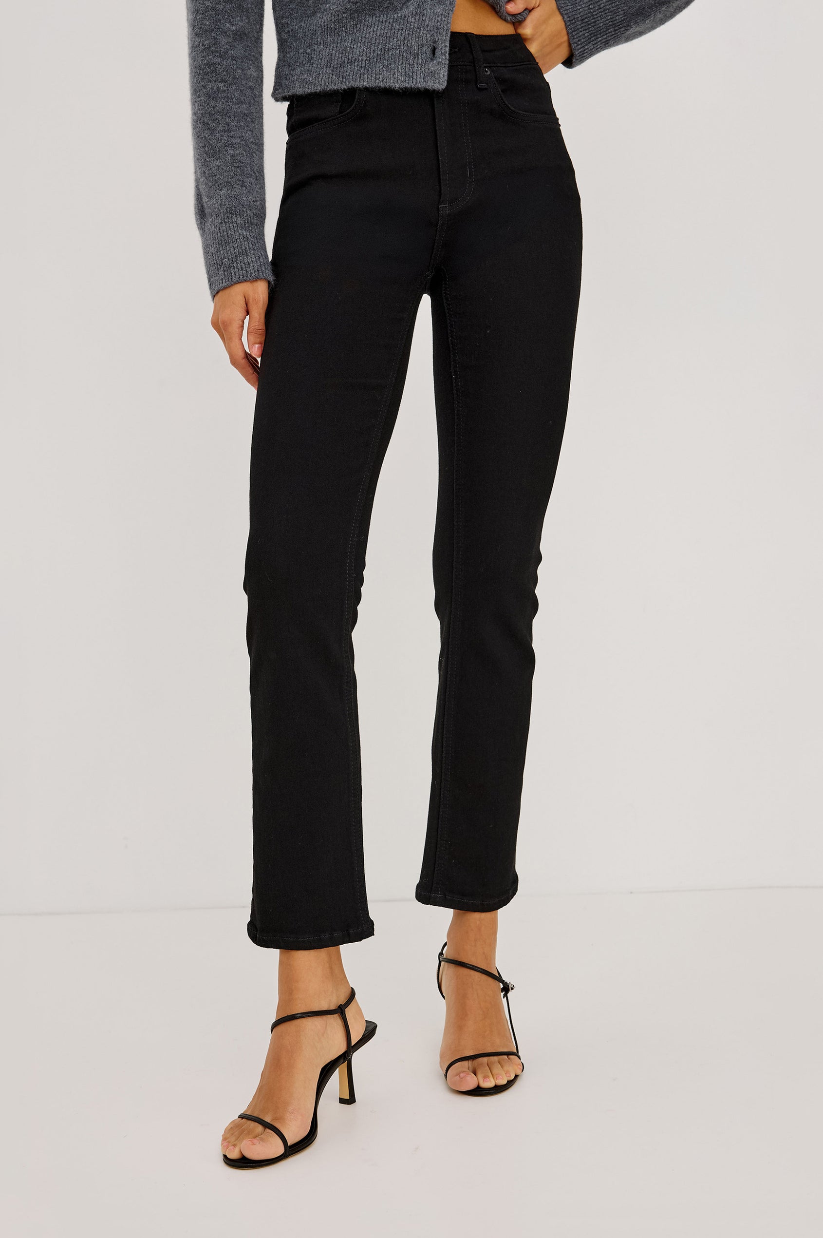 Bixby Slim Jean in High-Stretch Denim With Mid-Rise, Slim Legs, Zip Fly, and Ankle-Length Inseam in Blackout Colorway - Lower Body Front View Featured on Model