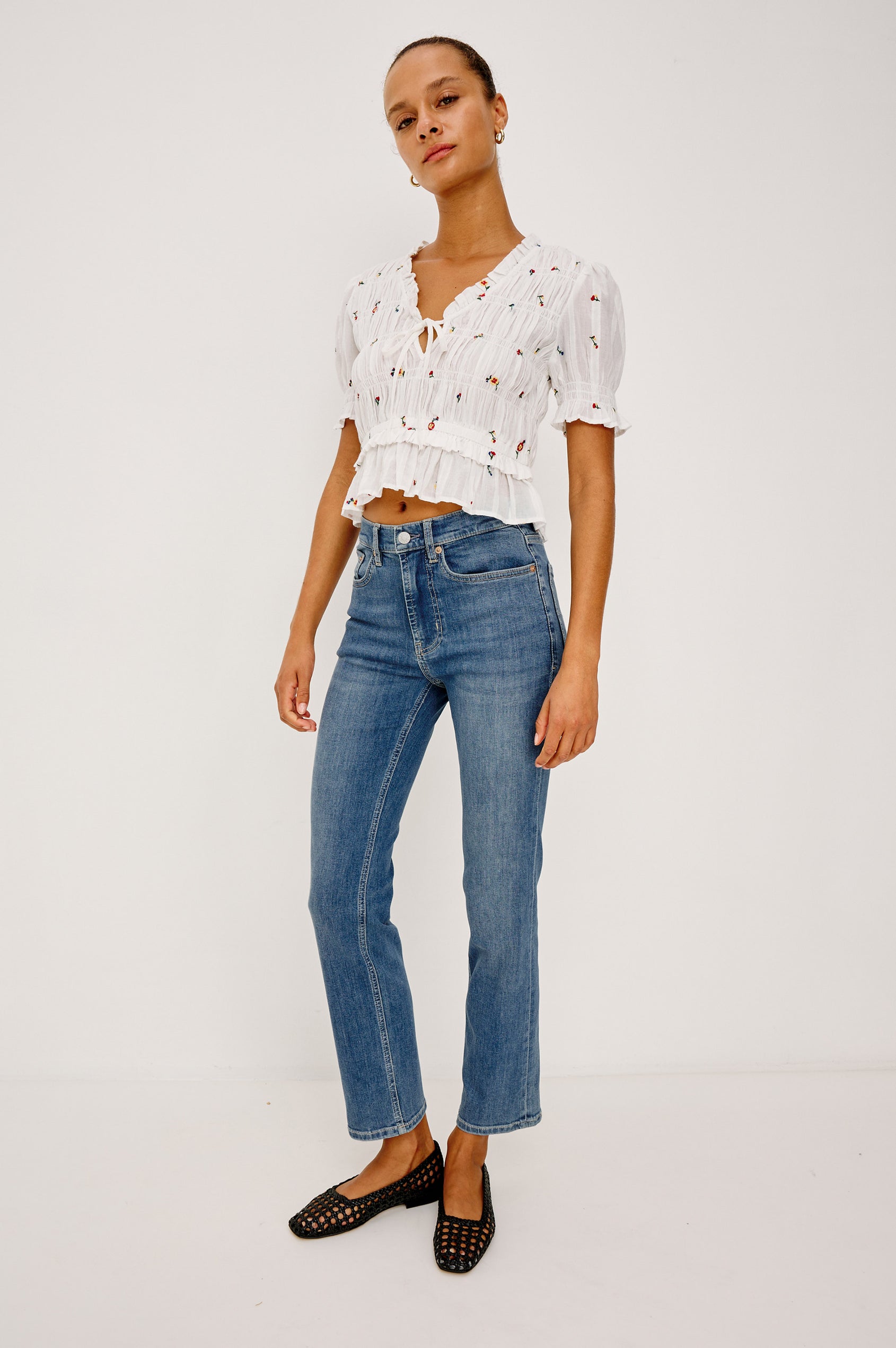 Bixby Mid-Rise Slim Straight Jean in High Stretch Denim With 28″ Inseam, Zip Fly, and 5-Pockets in East Coast Colorway - Full Body View Featured on Model