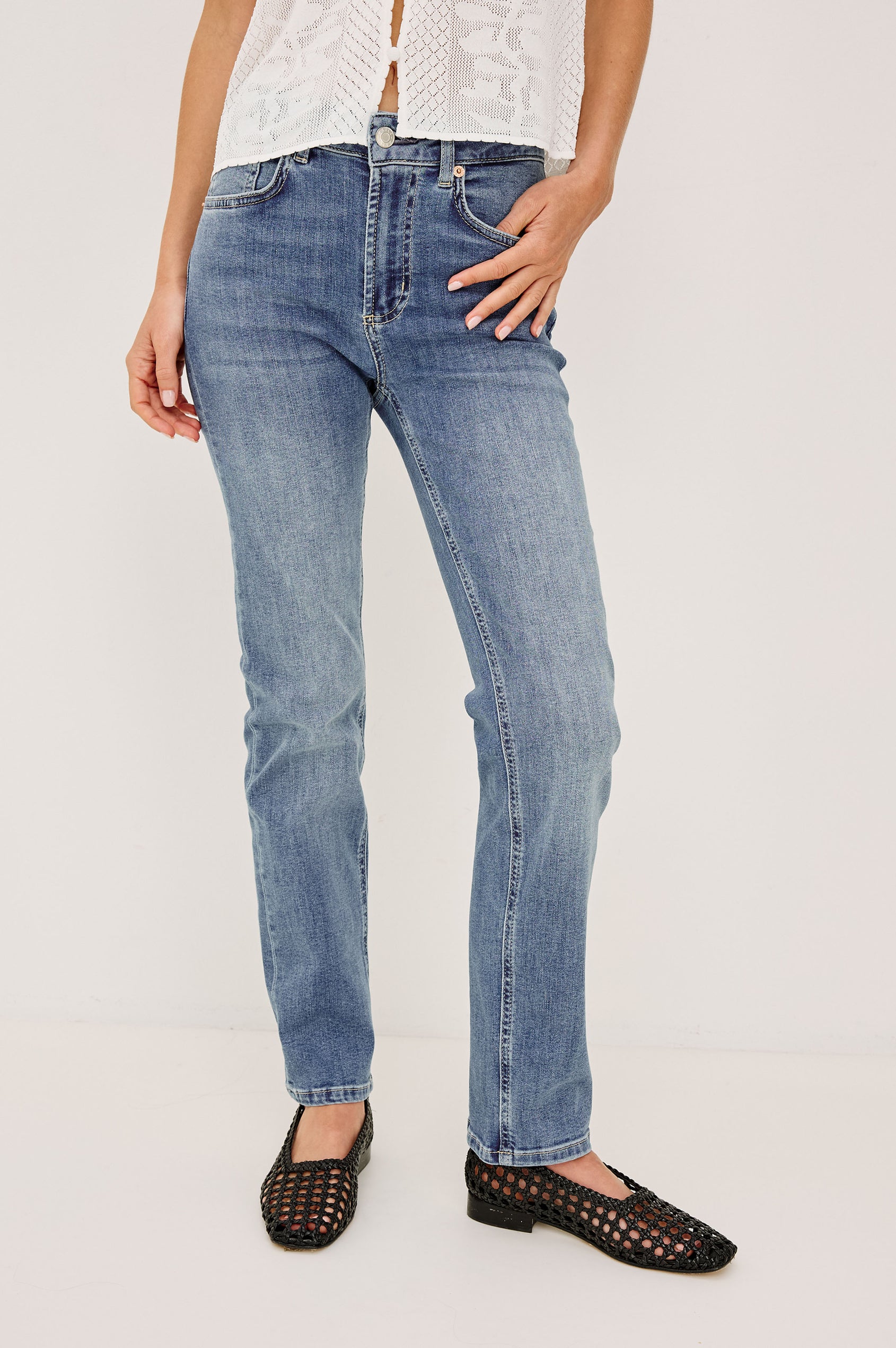 Bixby is a 5-pkt slim straight jean in Vista Blue colorway. Back close view featured on model.
