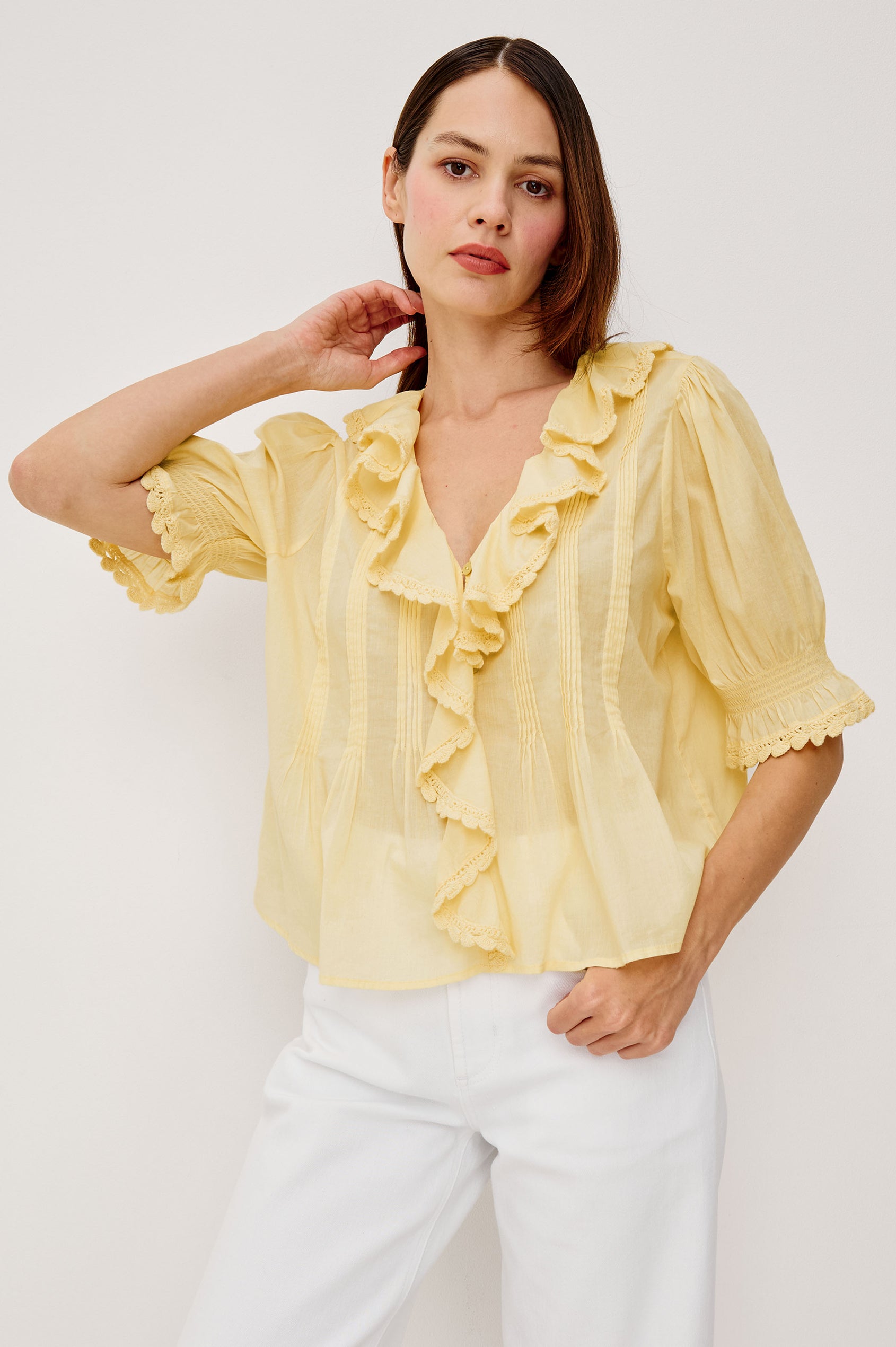 Bloom Poplin Top With Ruffle V-Neckline Elbow-Length Puff Sleeves With Ruffled Cuffs Pintuck Detailing and Boxy Relaxed Fit in Sunshine Colorway - Upper Body Front View Featured on Model