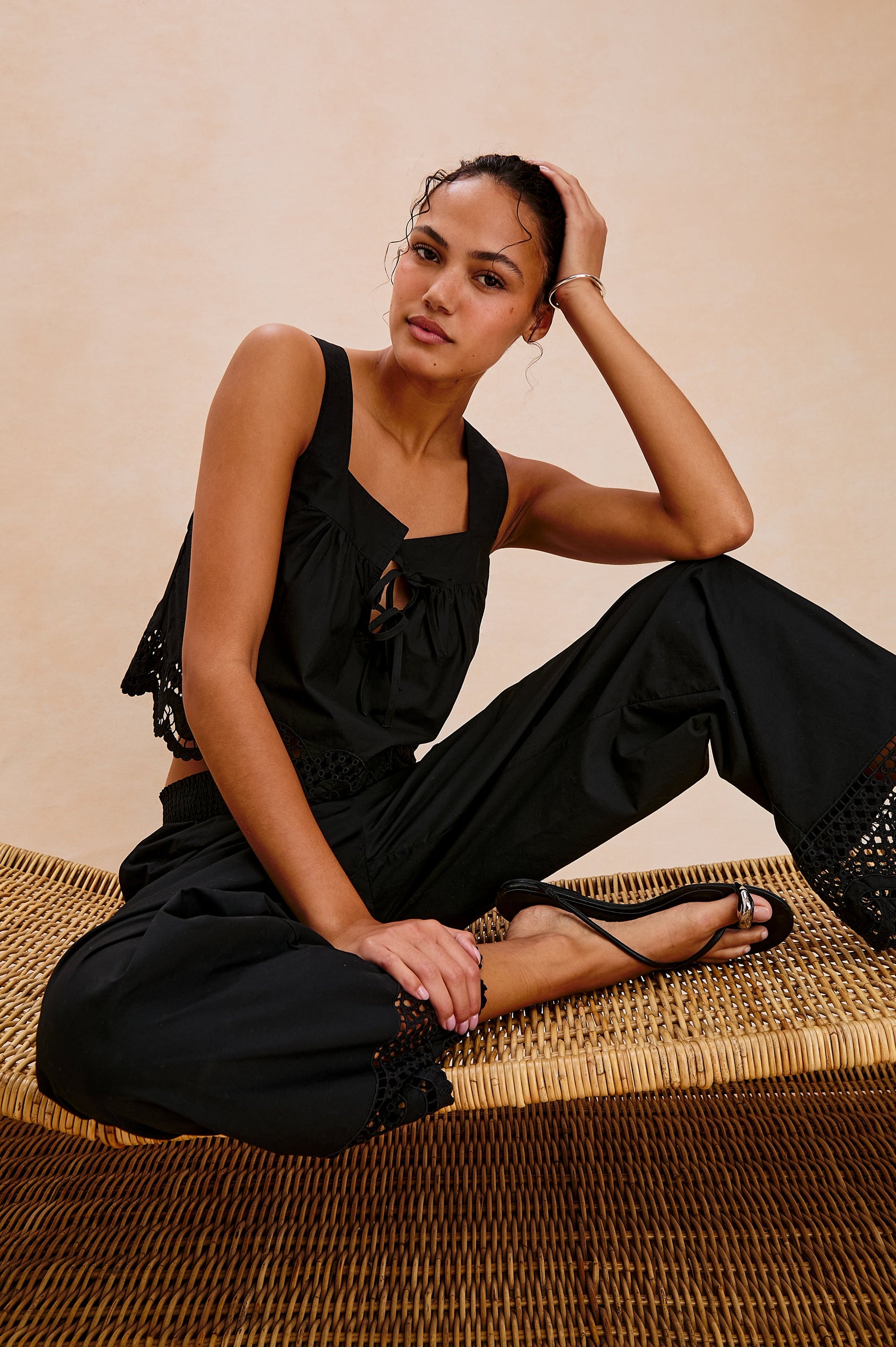 Blythe Square Neck Tank with Wide Straps, Two Front Ties and a Scalloped Hem in Black Colorway. Front View Shown on Model.