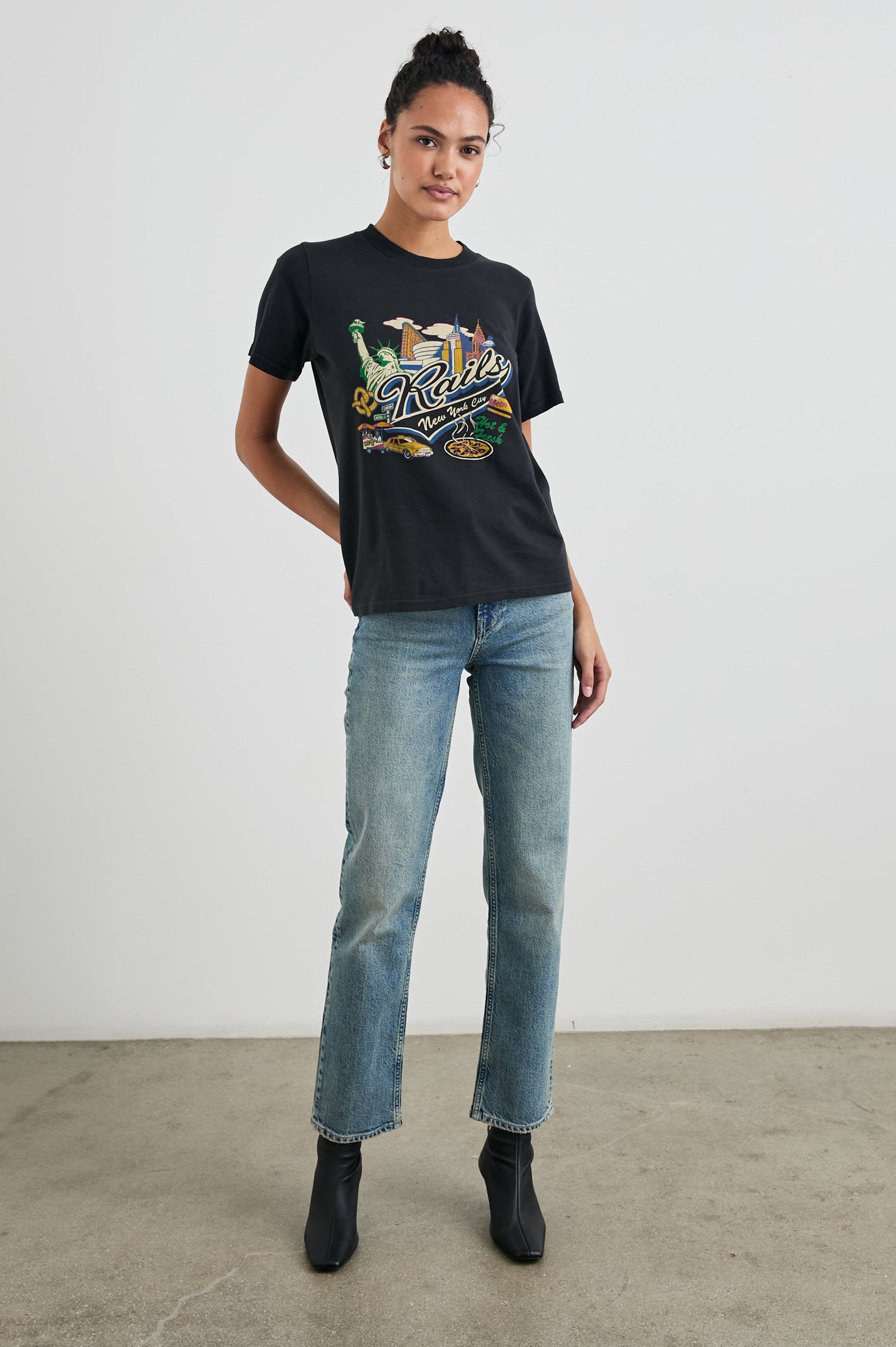 Boyfriend T-Shirt with a Crew Neck, New York images, and the text, Rails New York City, Hot and Fresh in Rails New York Colorway, with image and text in black browns, greens, pinks, white, blues on Black - Front Full Body View Featured on Model