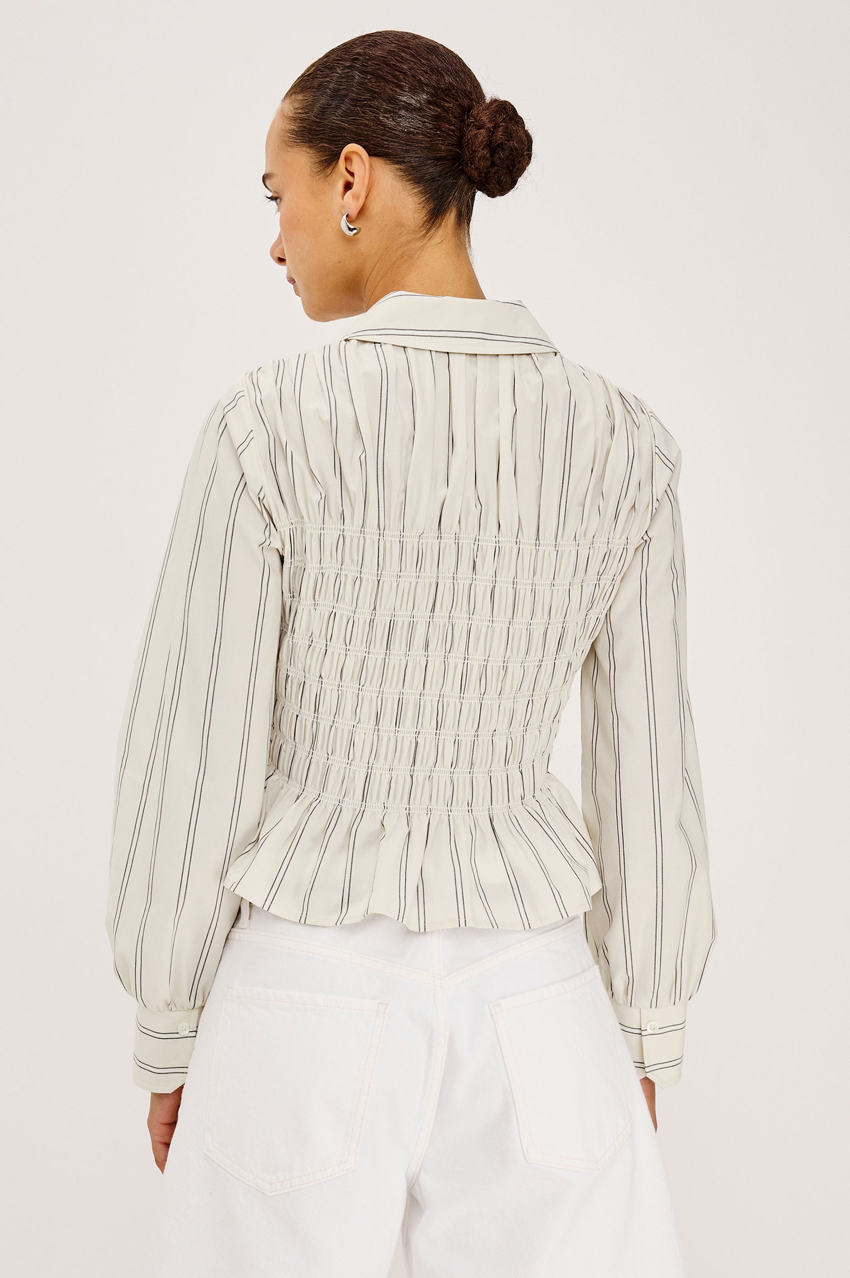 Bradshaw Button-Up Shirt in Cotton Poplin With Collar, Smocked Body, Peplum Hem, and Long Gathered Sleeves in Palma Stripe Colorway - Upper Body Back View Featured on Model