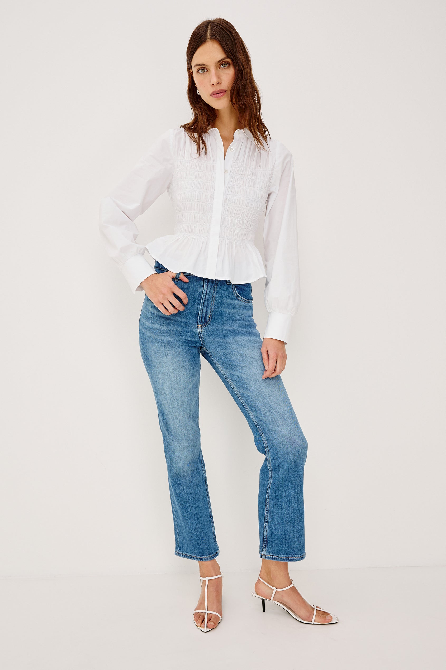 Bradshaw Button-Up Shirt in Cotton Poplin With Collar, Smocked Body, Peplum Hem, and Long Gathered Sleeves in White Colorway - Full Body Front View Featured on Model