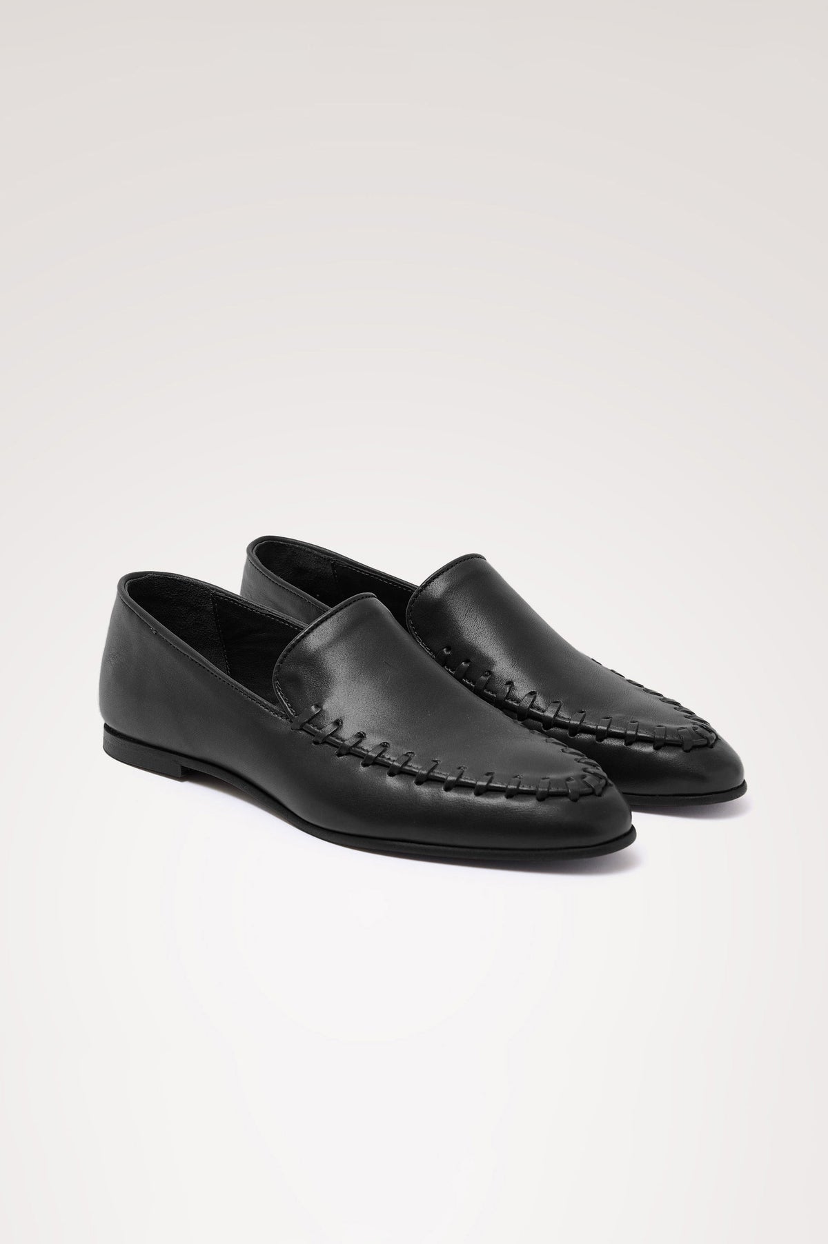 Braga Loafer in Full-Grain Leather With Whipstitch Trim, Narrow Vamp, and Low Heel in Black Colorway - Side Product View Featured