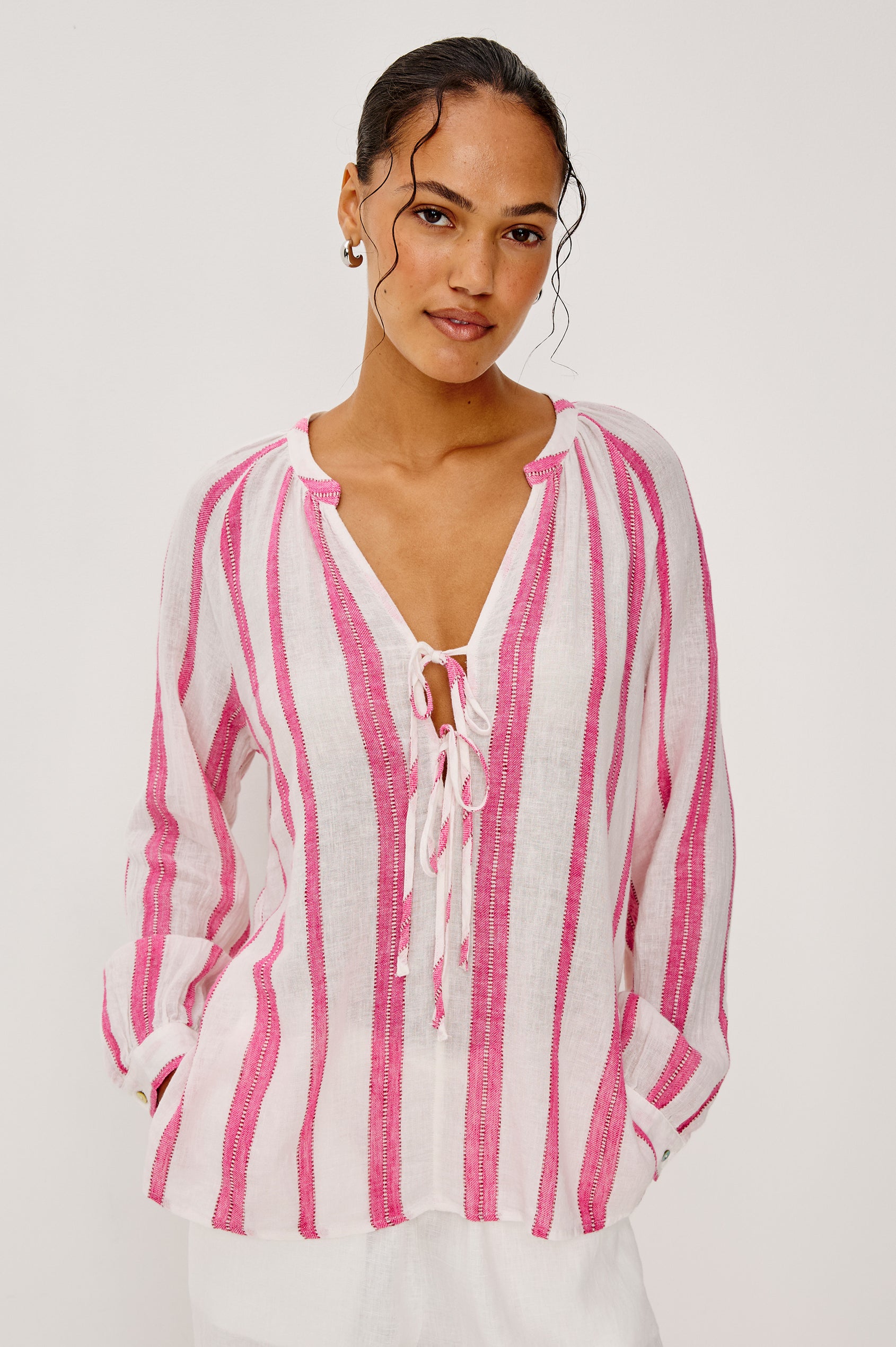 Brielle Blouse in Linen With Mandarin Collar, Loose Fit, Deep V-Neckline With Self-Ties, and Long Sleeves in Delfine Stripe Colorway - Upper Body Front View Featured on Model
