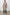 Bristol Knee-Length Double Breasted Coat with Two-Button Closure, Notched Lapels, Two Front Flap Pockets, Center Back Seams, and a Belted Back in Mink Colorway, a Light Brown - Back Full View Featured on Model  