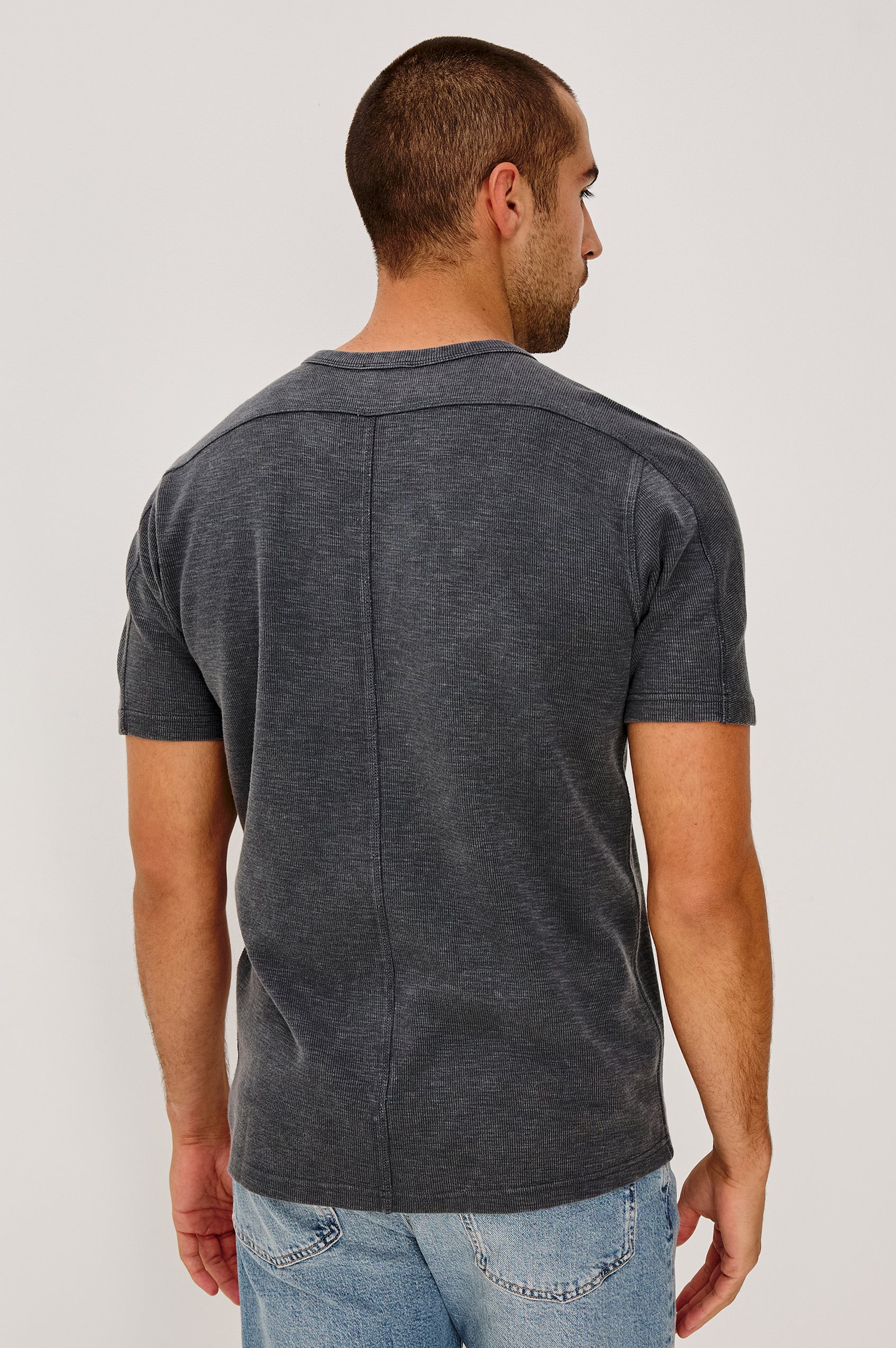 Brooks Short Sleeve T-Shirt With Crew Neckline, Short Sleeves, and Classic Fit in Washed Black Colorway - Upper Body Back View Featured on Model