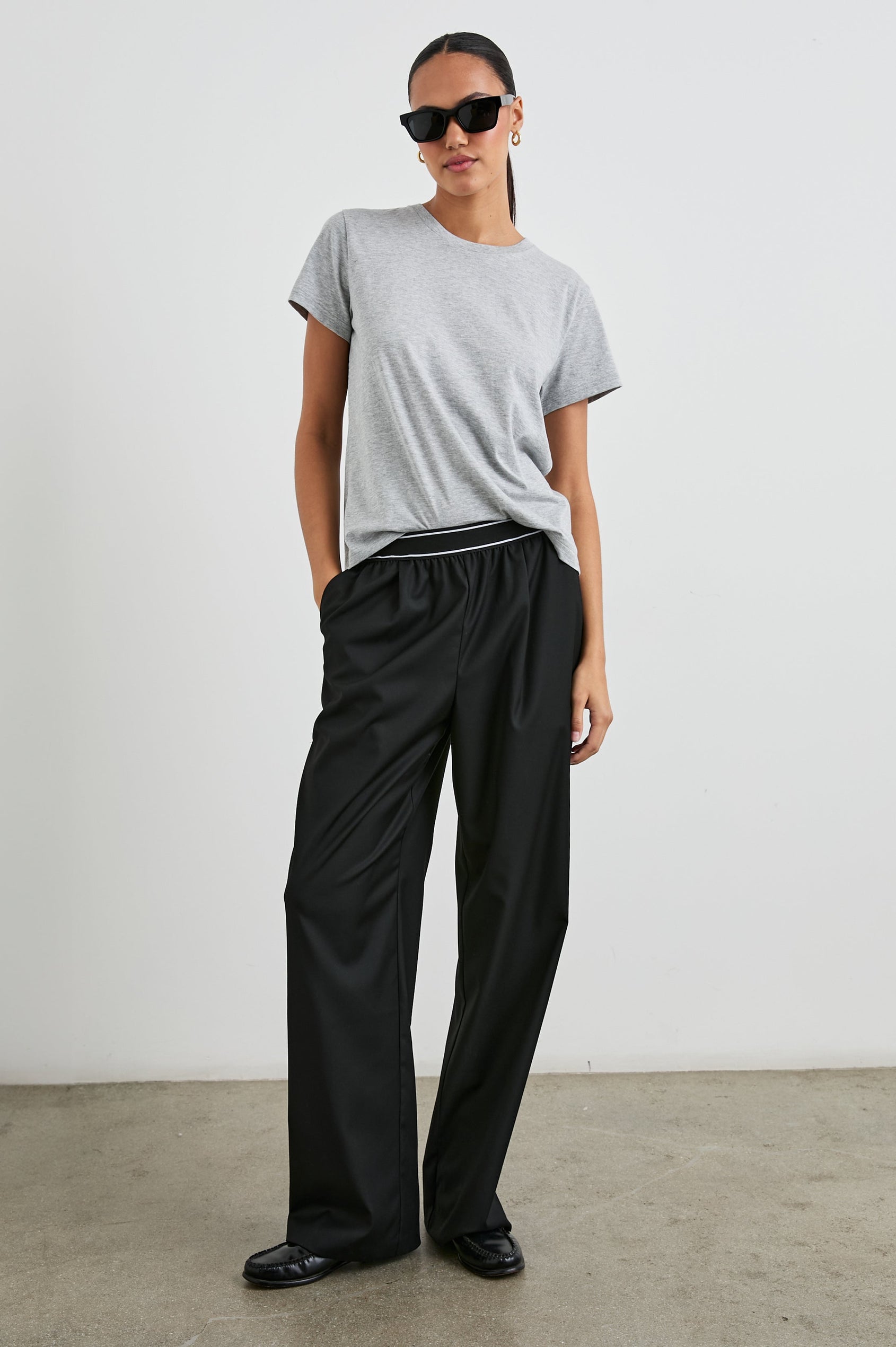 Brynn Pants with Two Front Pockets and Elastic Waist Band with White Trim in Black Colorway - Front Full Body View Featured on Model