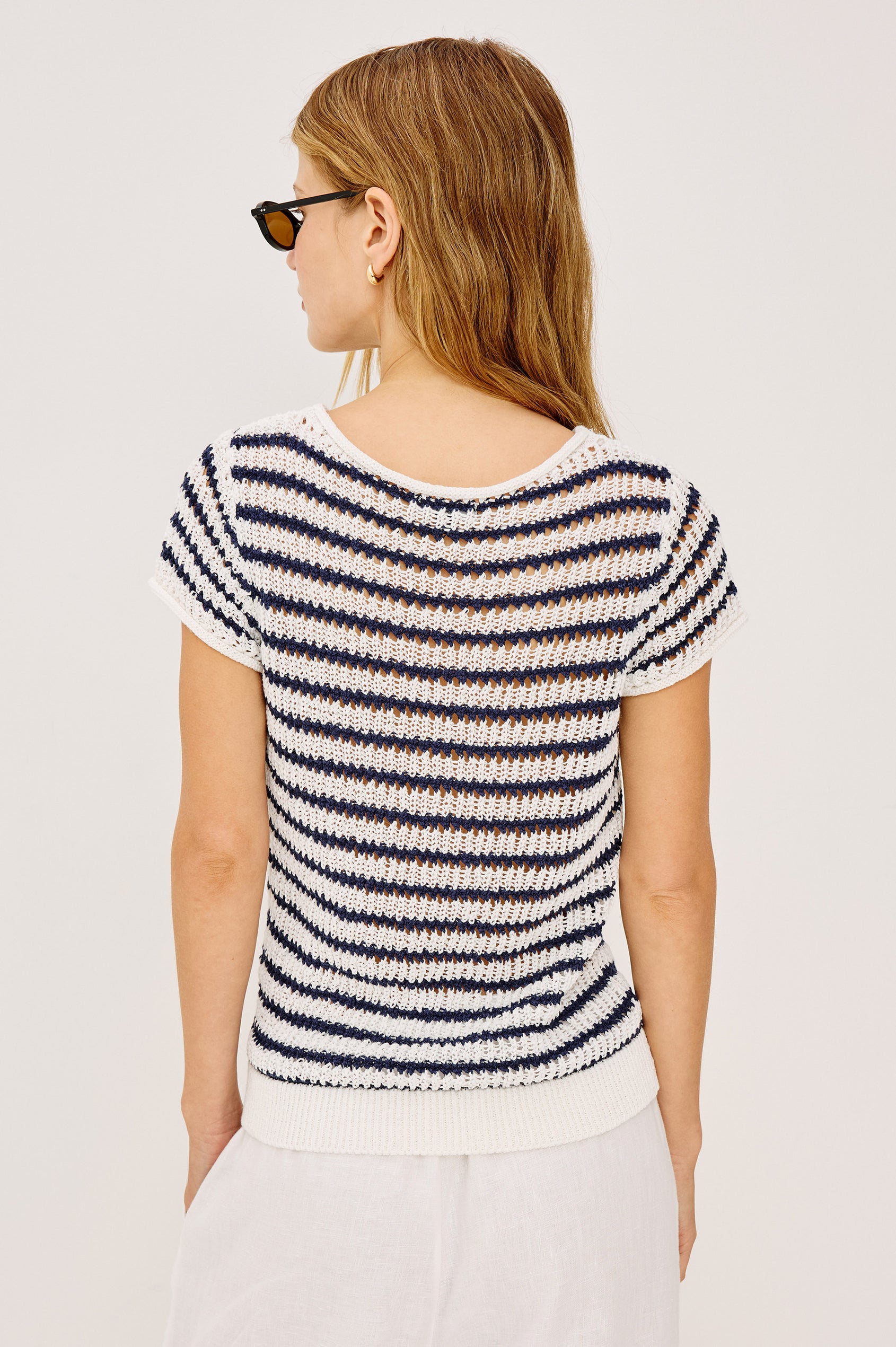 Cady Top in Semi-Sheer Linen-Blend Knit With Rolled Neckline, Cap Sleeves, and Classic Fit in Ivory Indigo Stripe Colorway - Upper Body Back View Featured on Model