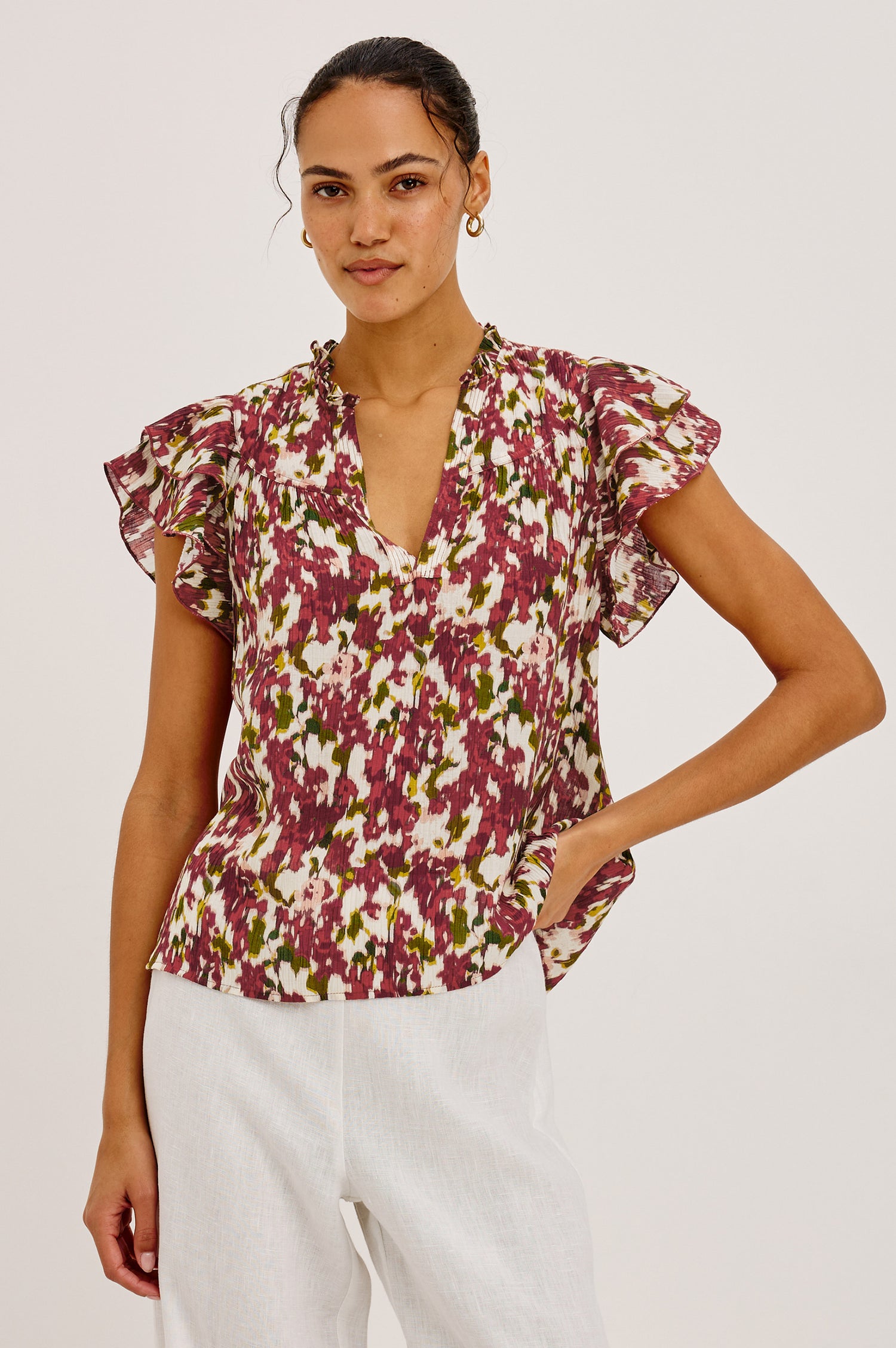 Calista Top in Textured Chiffon With Ruffle Trim Split V-Neckline, Layered Flutter Sleeves, and Relaxed Fit in Cardinal Floral Colorway - Upper Body Front View Featured on Model