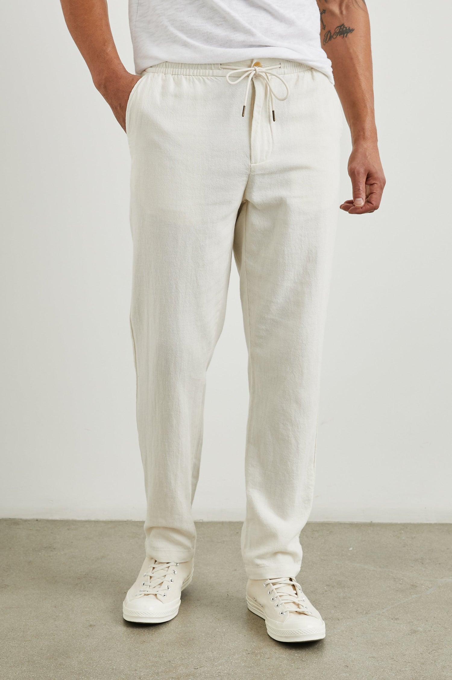 Callum Pants with a Drawstring Waist, Two Front Pockets and a Back Patch Pocket in Ecru Colorway - Front View Featured on Model