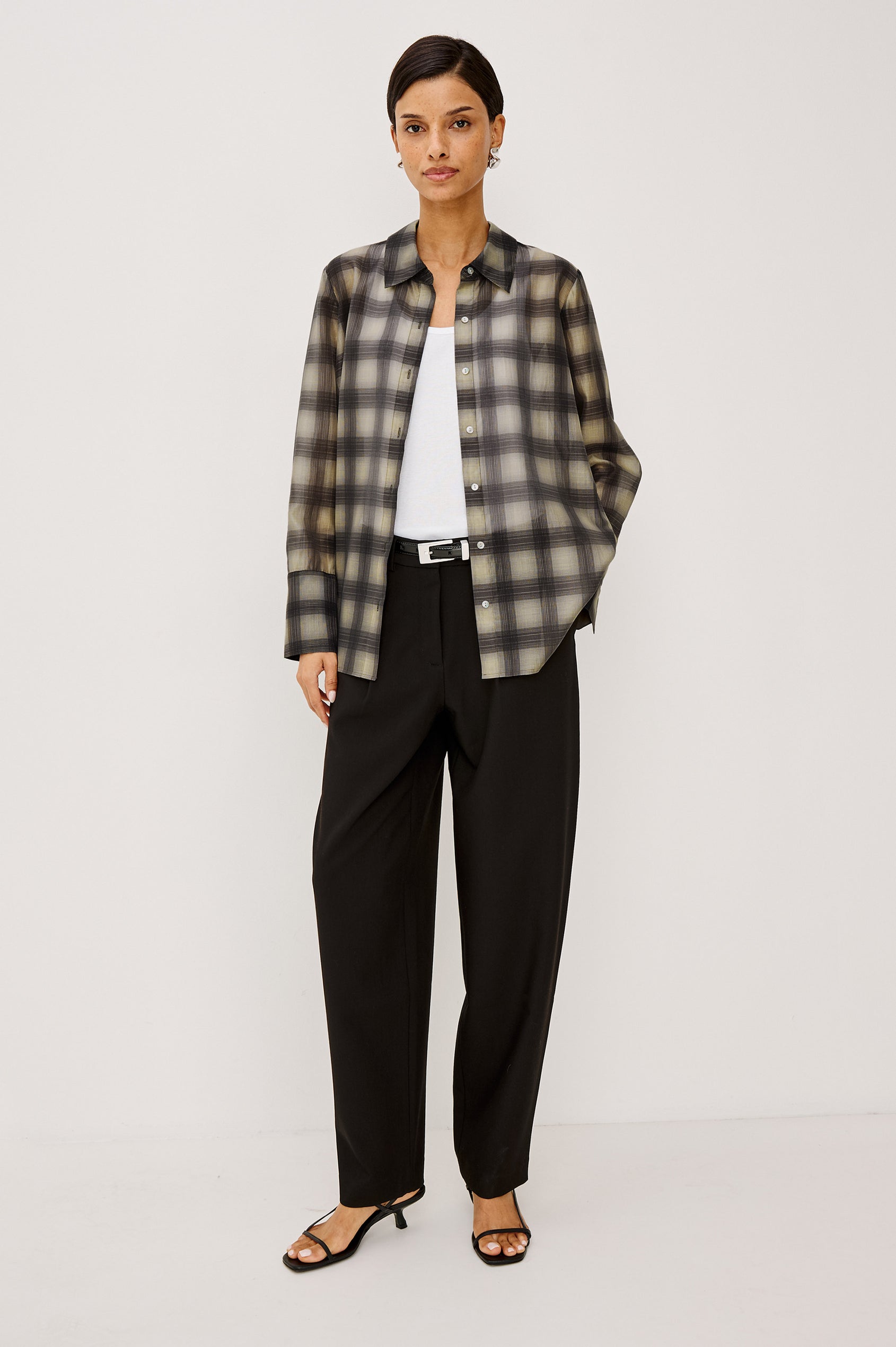 Cameron Pant in Springy Suiting Fabric With High-Rise, Pleated Barrel Legs That Taper, Side and Back Pockets, and Unlined in Black Colorway - Full Body Front View Featured on Model