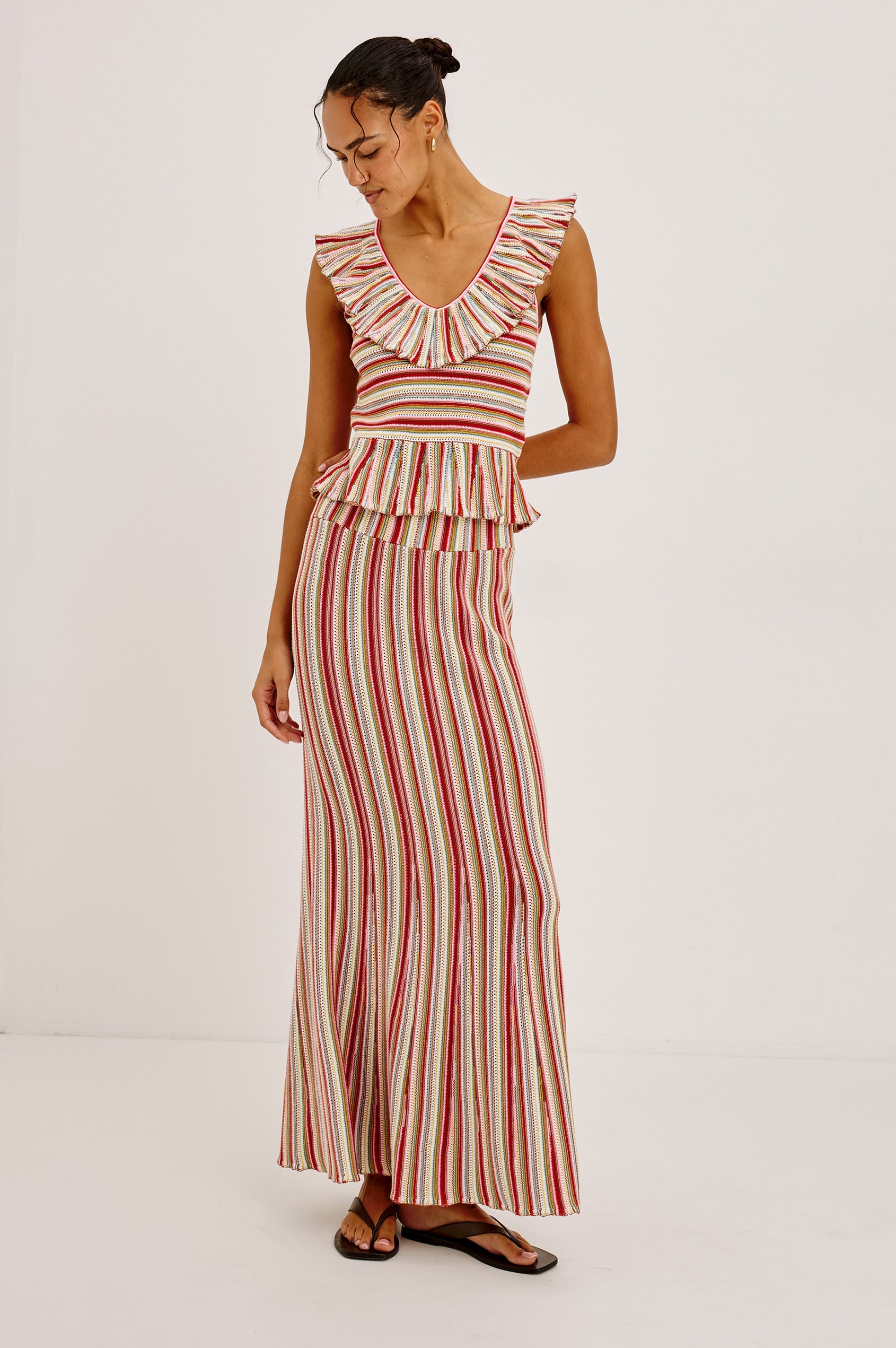Carmelita Crop Top in Crochet Knit With Ruffle V-Neckline, Fitted Bodice, and Peplum Hem in Havana Stripe Colorway - Full Body Front View Featured on Model