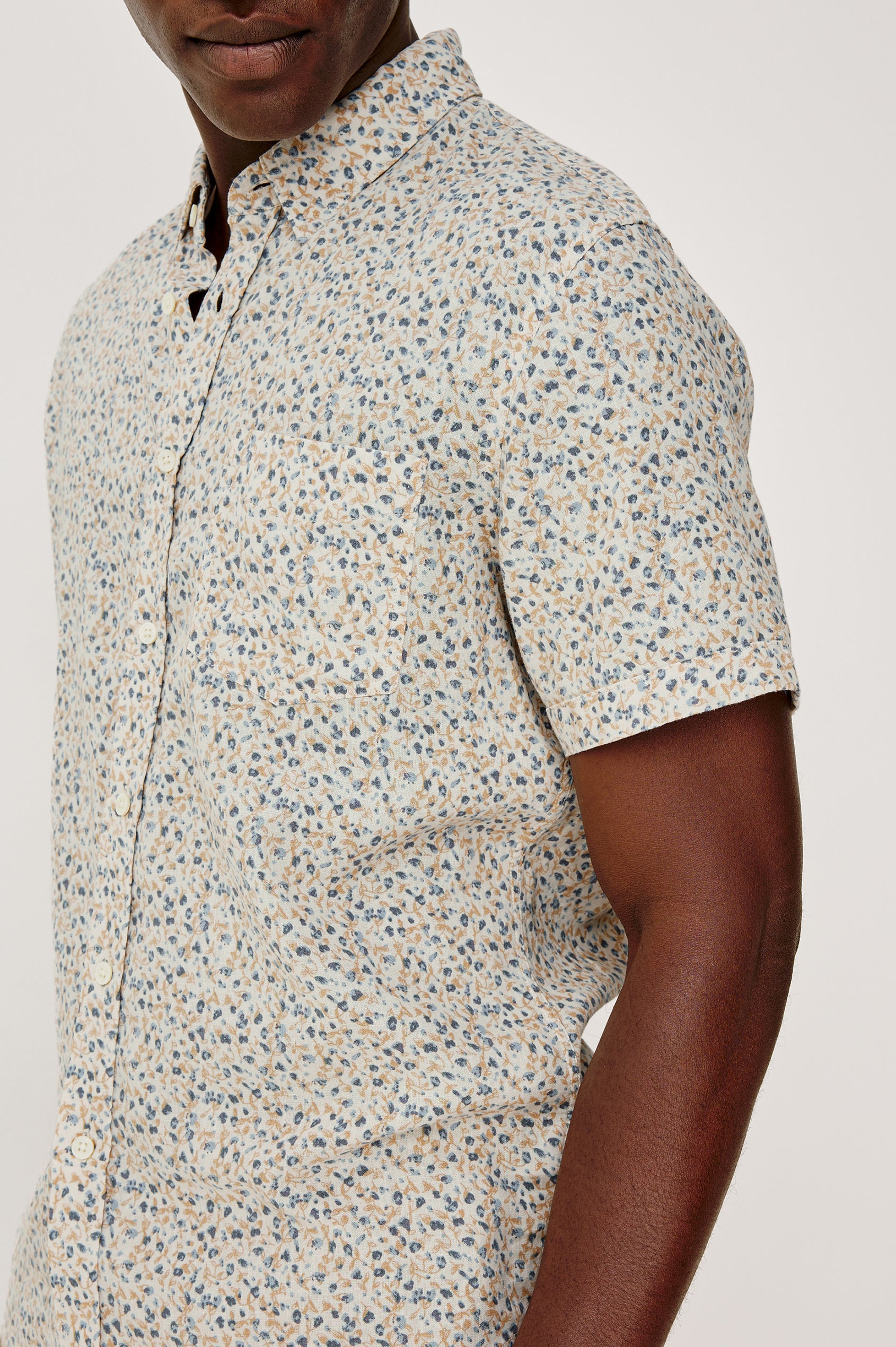 Carson Button Front Shirt in Linen Blend With Collar, Short Sleeves, Chest Patch Pocket, and Classic Fit in Spring Blossom Parchment Colorway - Upper Body Front Close Up View Featured on Model