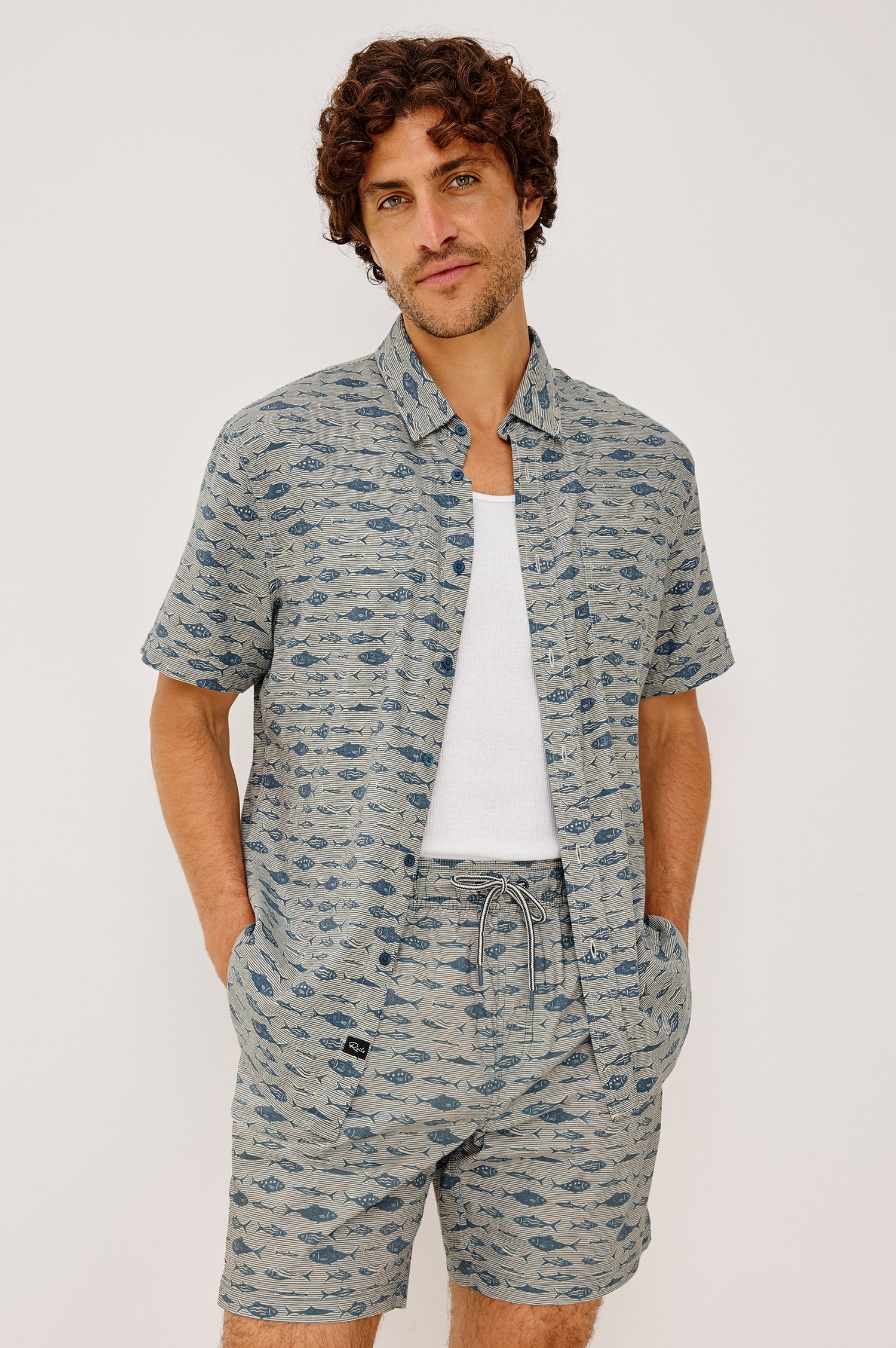 Carson Button-Up Shirt in Lighweight Seersucker With Collar, Chest Patch Pocket, Short Sleeves, and Classic Fit in Vintage Aquarium Etch Batik Colorway - Upper Body Front View Featured on Model