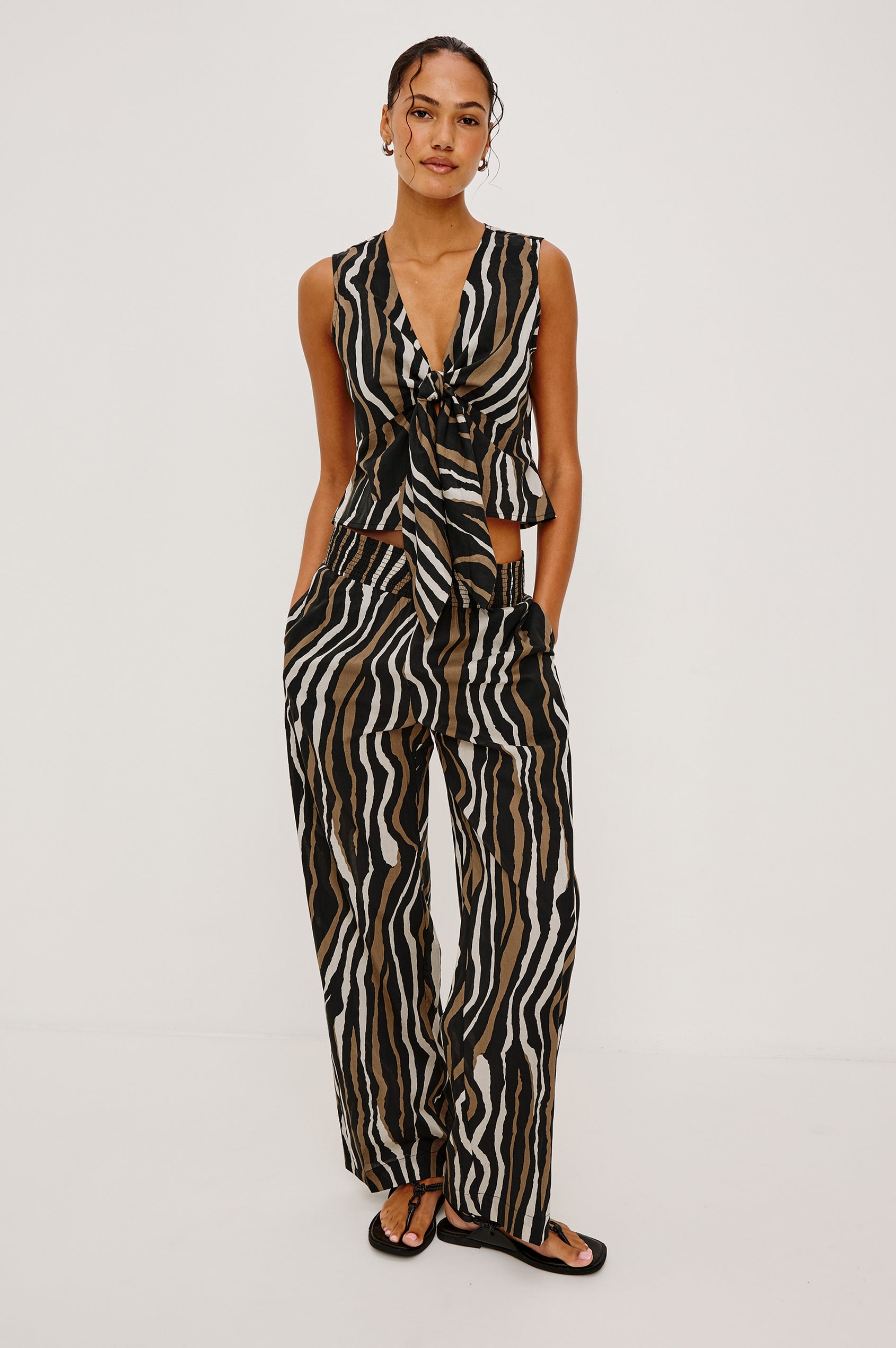 Chala Cropped Sleeveless Top in Beach Cotton With Deep V-Neckline With Adjustable Self-Ties in Canyon Stripe Colorway - Full Body Front View Featured on Model