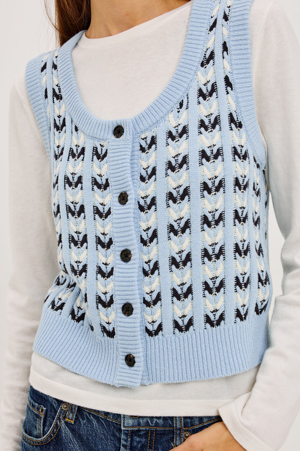 Chance Vest in Cable Knit With Scoop Neckline, Sleeveless Design, Front Button Closures, and Relaxed Fit in Sky Blue Colorway - Upper Body Front View Featured on Model