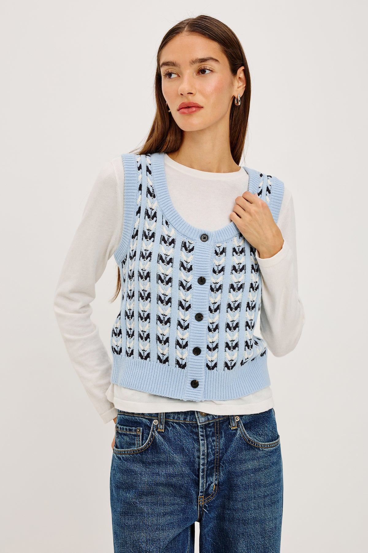 Chance Vest in Cable Knit With Scoop Neckline, Sleeveless Design, Front Button Closures, and Relaxed Fit in Sky Blue Colorway - Upper Body Front View Featured on Model