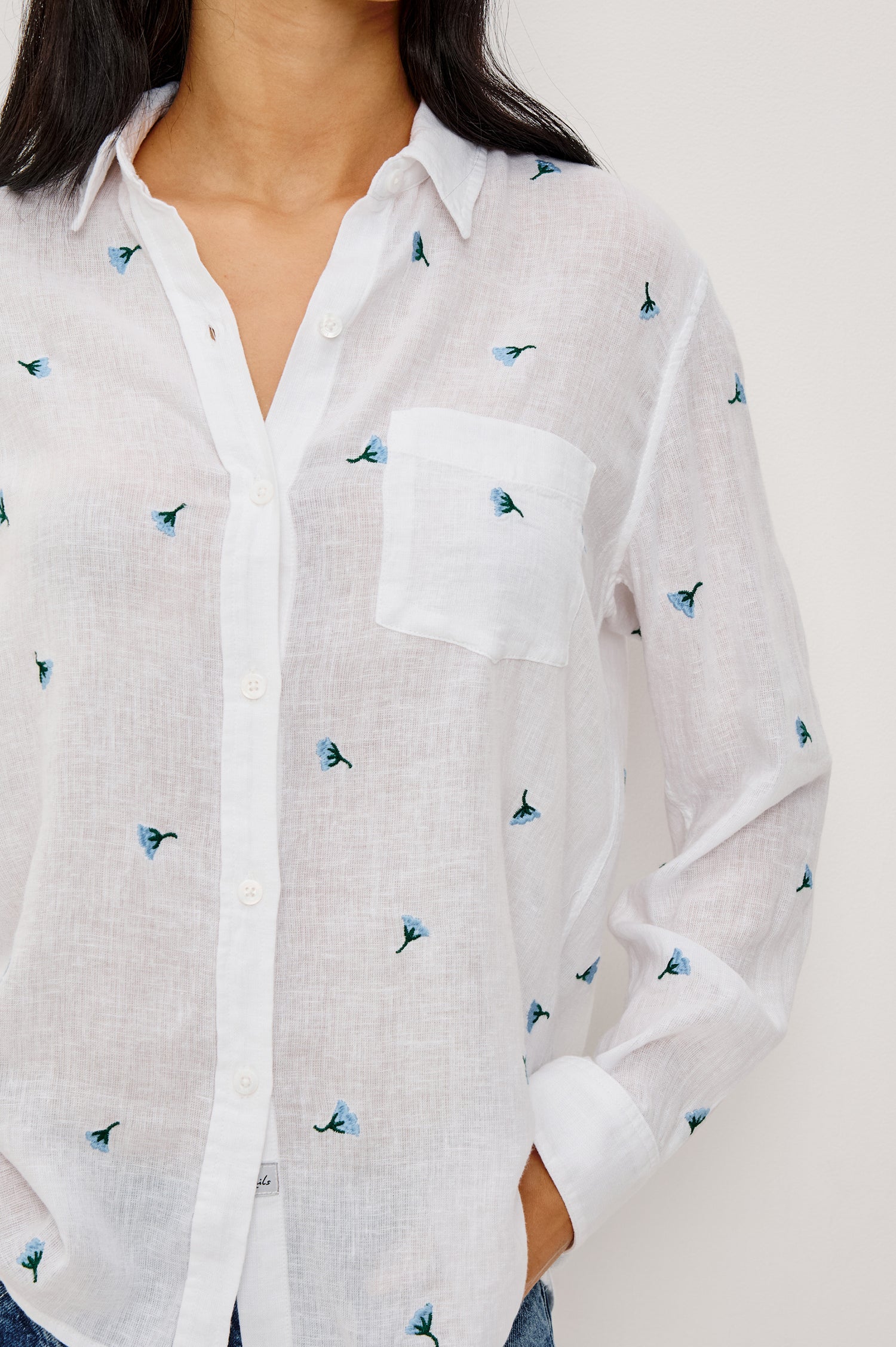 Charli Button-Up Shirt in Eco-Friendly Linen Blend With Collar Long Sleeves Single Chest Patch Pocket in Bluebell Carnations Colorway - Upper Body Close Up Front View Featured on Model