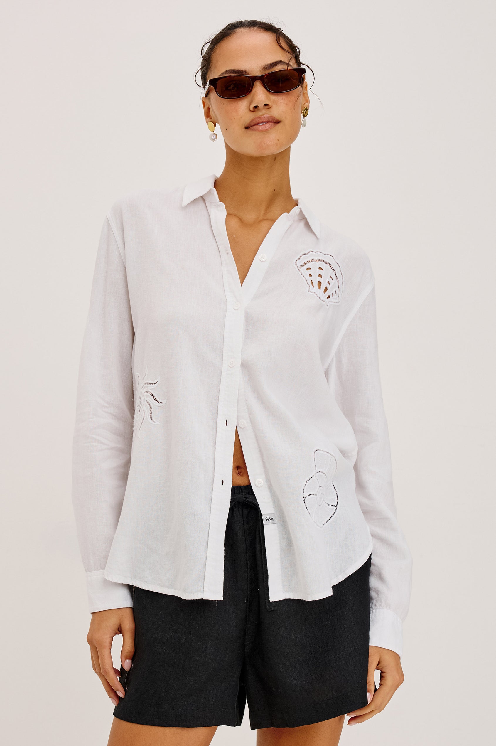 Charli Button-Up Shirt in Linen Blend With Collar, Long Sleeves, Relaxed Fit, Embroidered Cutwork Detailing, and Single Chest Patch Pocket in White Seashells Colorway - Upper Body Front View Featured on Model