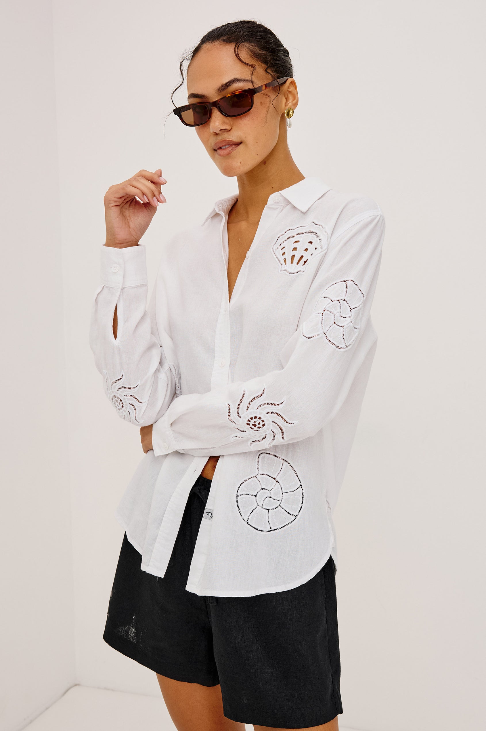 Charli Button-Up Shirt in Linen Blend With Collar, Long Sleeves, Relaxed Fit, Embroidered Cutwork Detailing, and Single Chest Patch Pocket in White Seashells Colorway - Upper Body Front View Featured on Model
