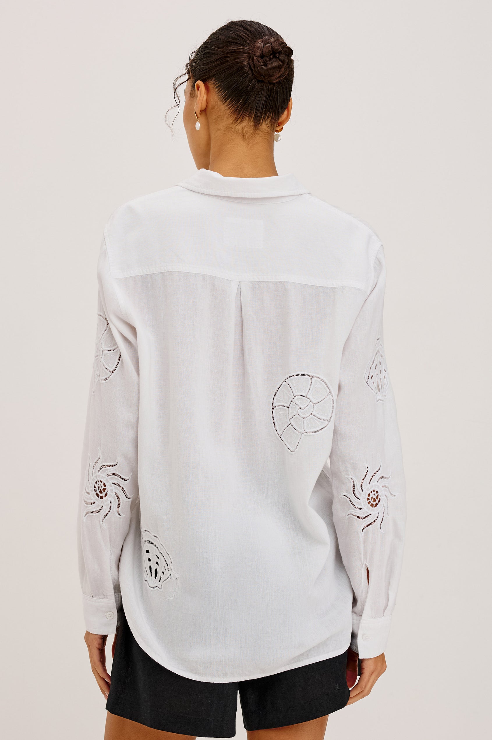 Charli Button-Up Shirt in Linen Blend With Collar, Long Sleeves, Relaxed Fit, Embroidered Cutwork Detailing, and Single Chest Patch Pocket in White Seashells Colorway - Upper Body Back View Featured on Model