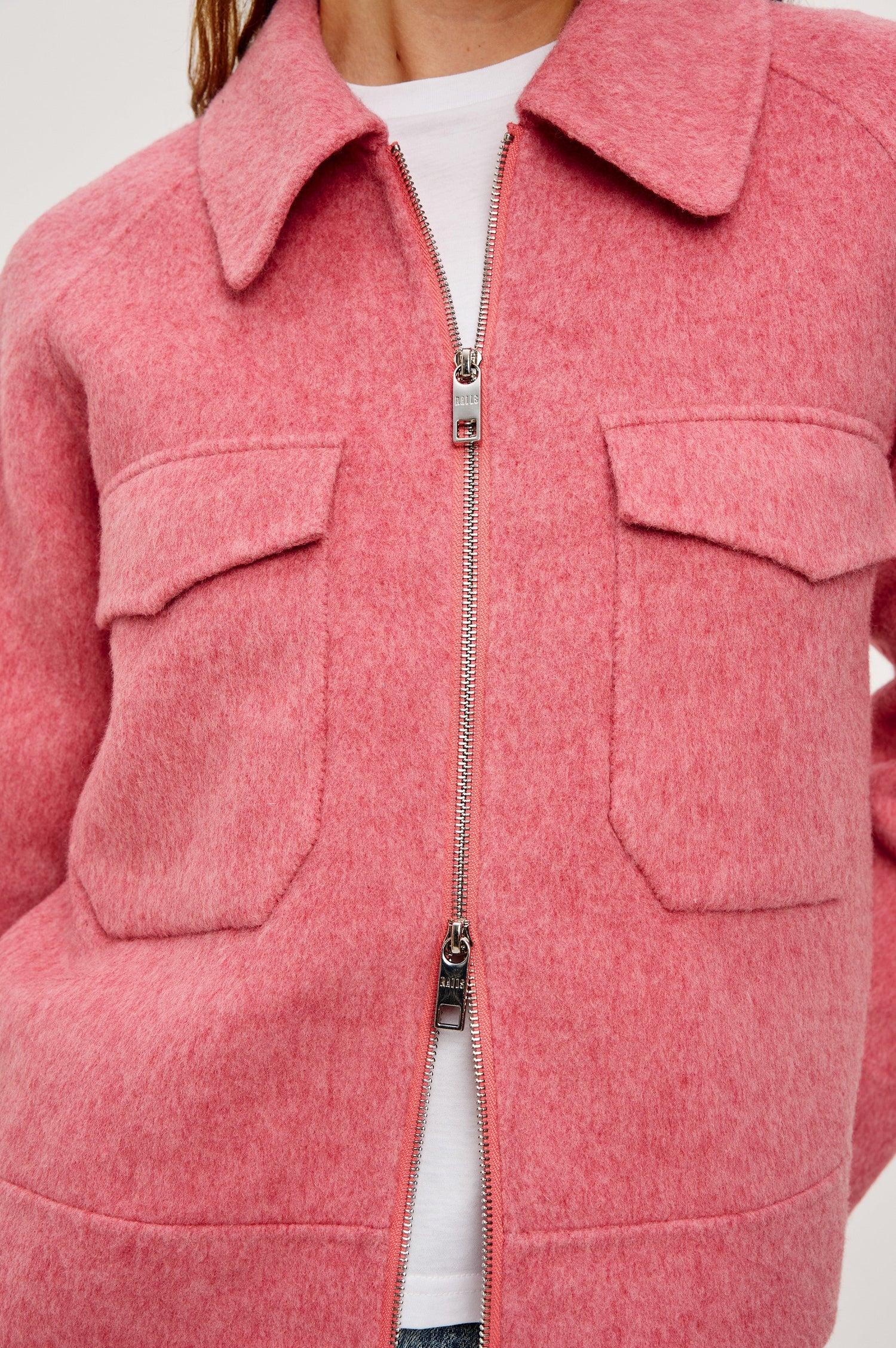 Cheyenne fitted wool jacket with oversized pockets and collar in Heather Rose colorway - Close up view on model, zipped