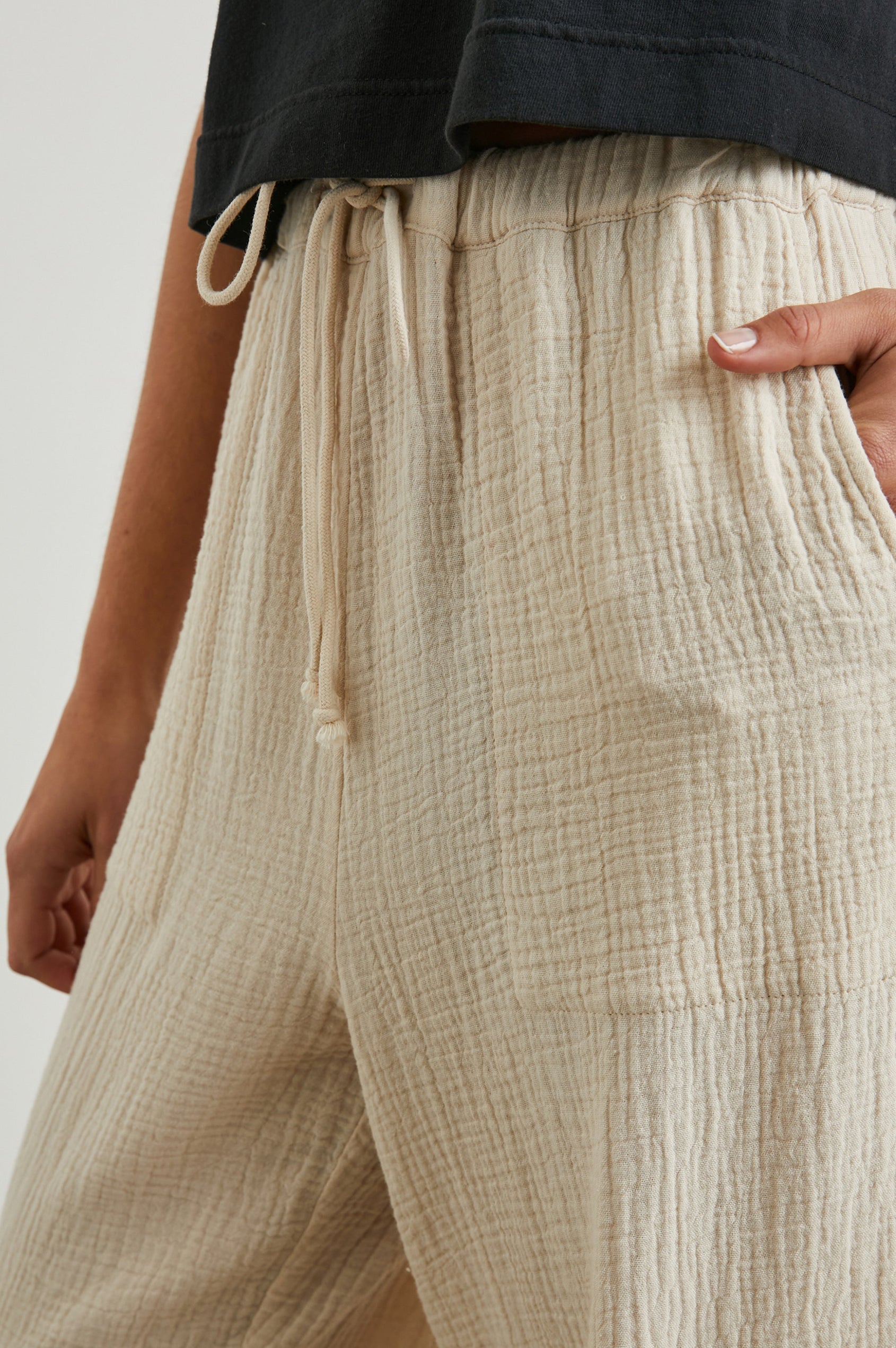 Christiano Pants with a Drawstring Waist, Two Front Pockets and Two Flap Side Pockets in Flax Colorway - Front View Featured on Model  